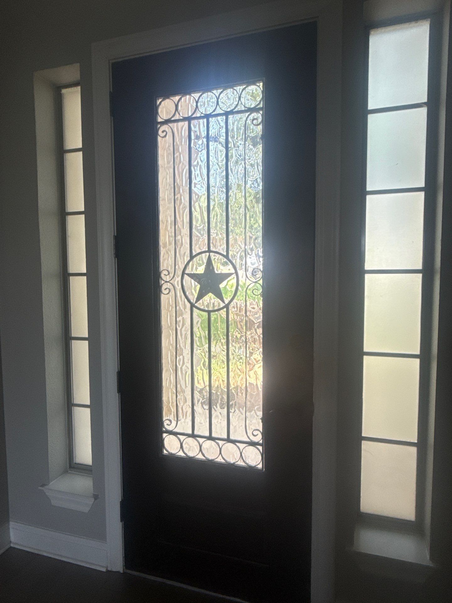 Front door detail of a home on Tree Bend Cove in Austin, TX ahead of interior painting by Hill Country Painting
