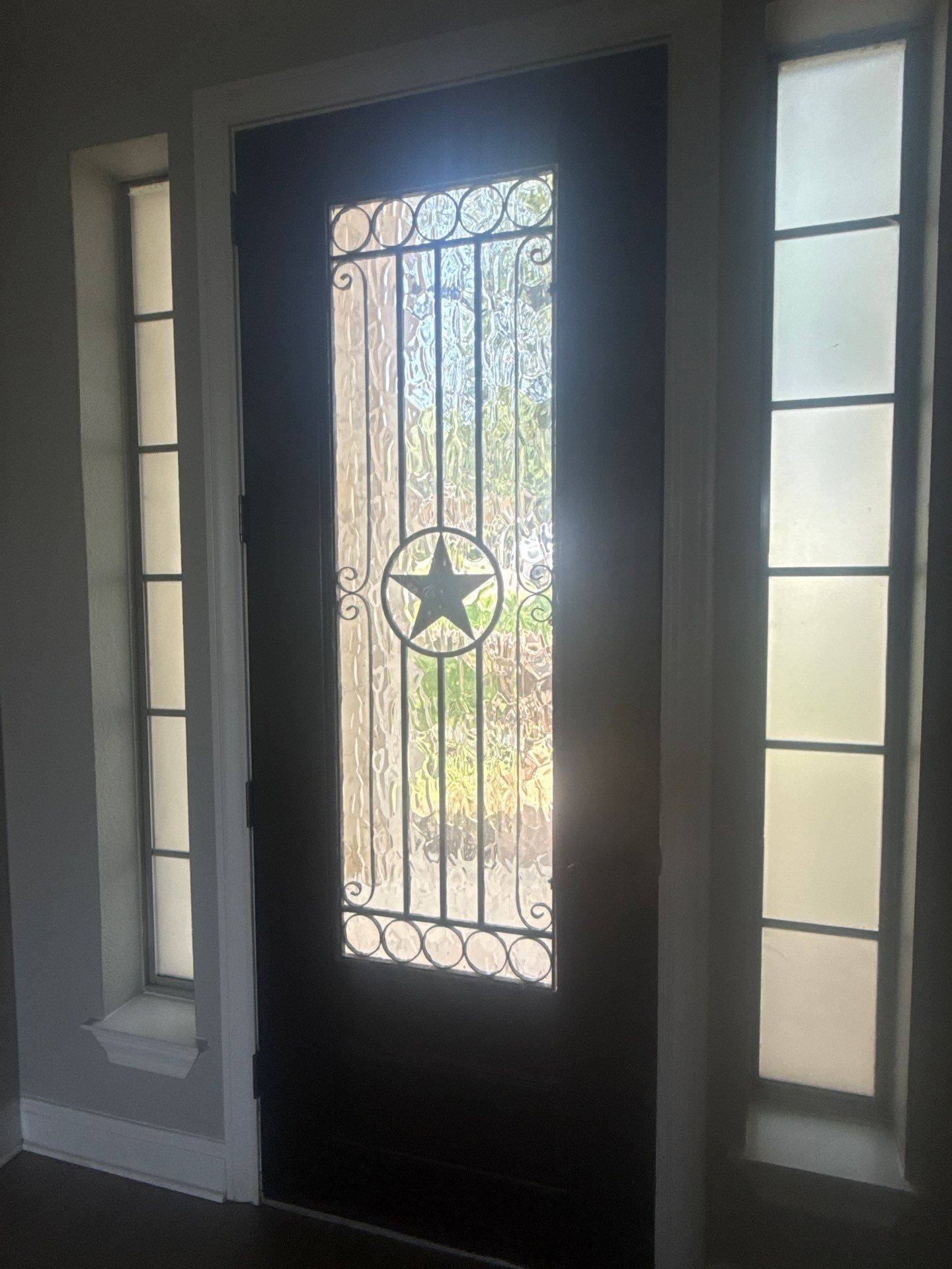 Front door detail of a home on Tree Bend Cove in Austin, TX ahead of interior painting by Hill Country Painting