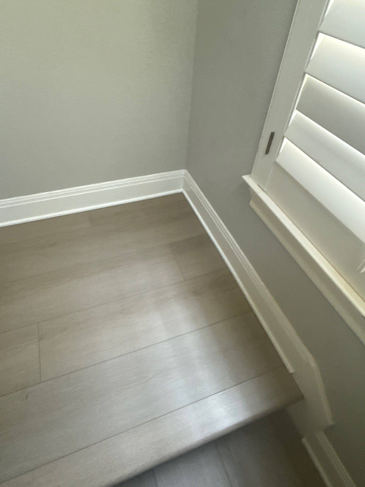 Baseboard and window trim detail of a home on Tree Bend Cove in Austin, TX ahead of interior painting by Hill Country Painting