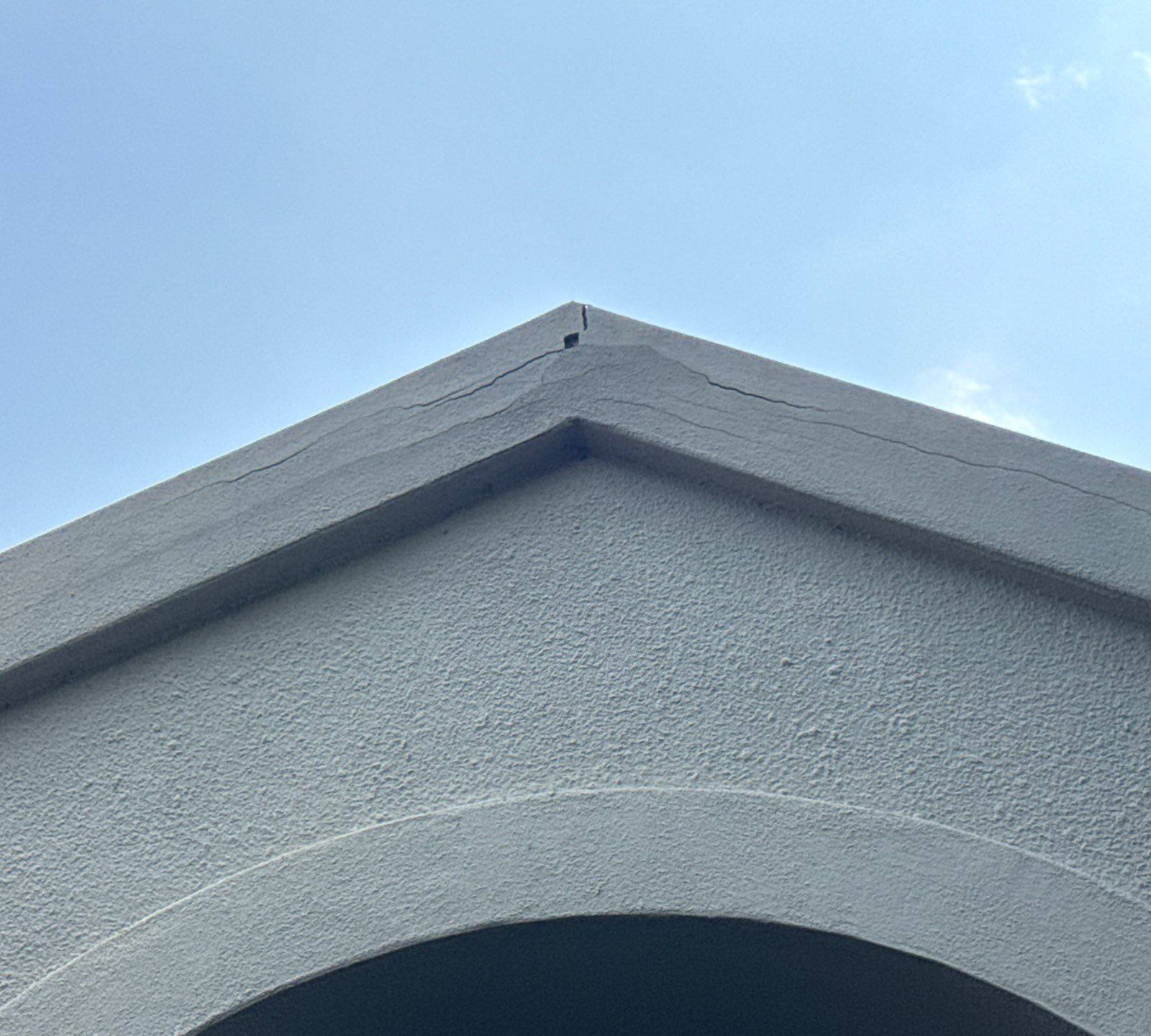 Stucco gable detail of a home on Tellus St in Lakeway, TX ahead of exterior painting by Hill Country Painting