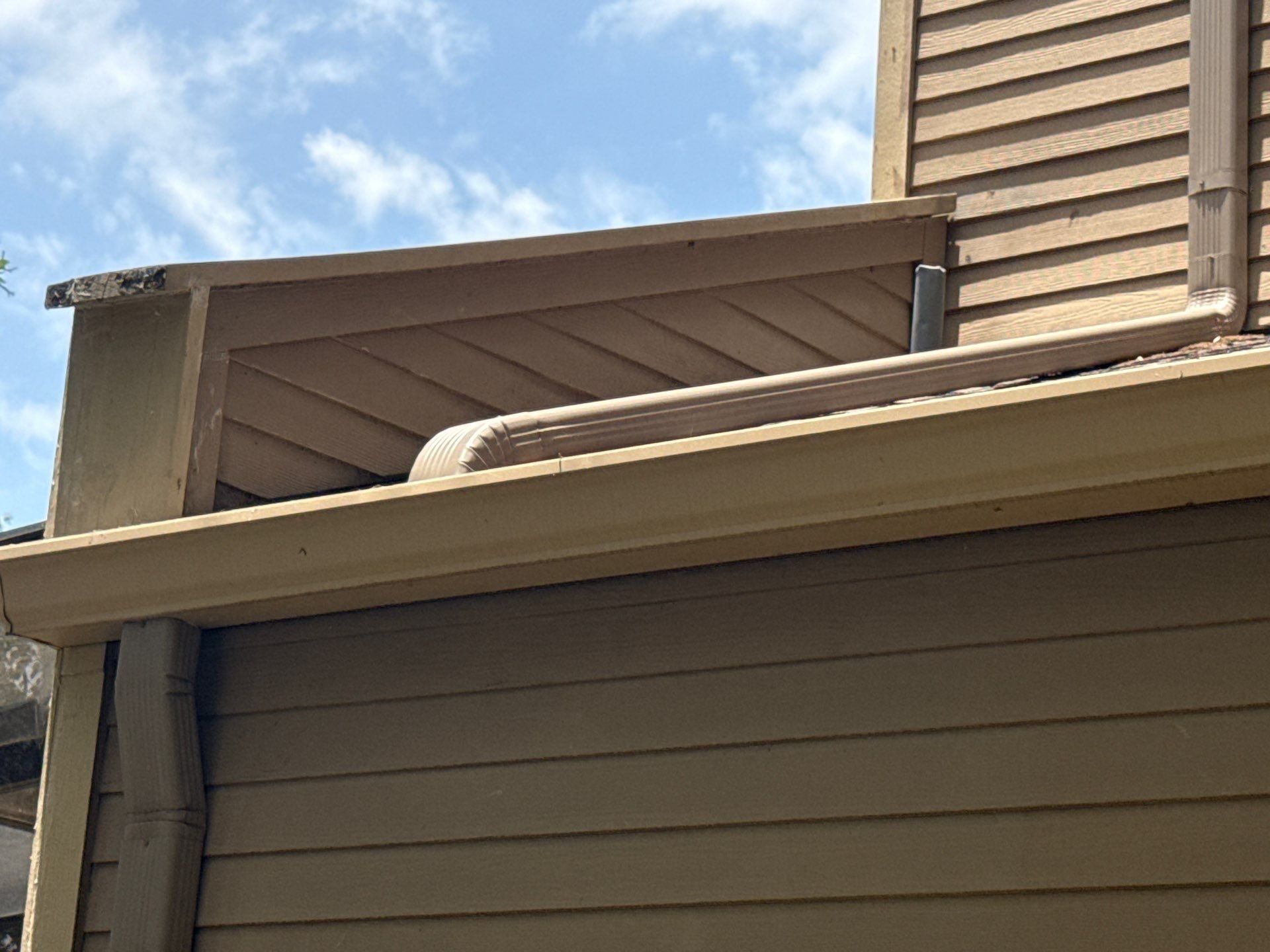 Soffit, fascia, and gutter detail on a home on Weatherwood Cove in Austin, TX ahead of exterior painting by Hill Country Painting