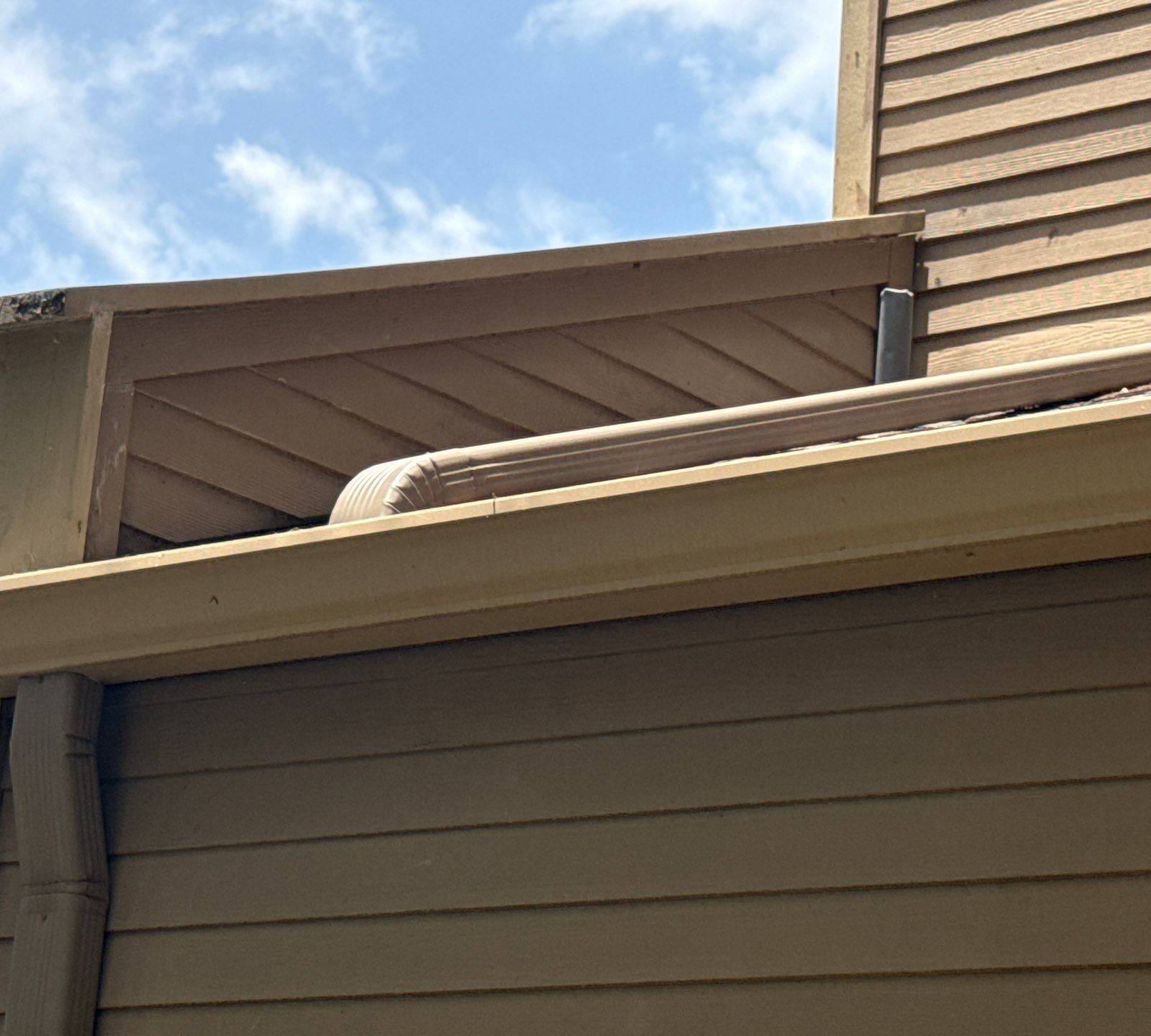 Soffit, fascia, and gutter detail on a home on Weatherwood Cove in Austin, TX ahead of exterior painting by Hill Country Painting