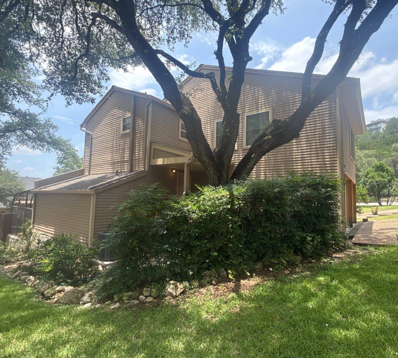 Exterior siding of a home on Weatherwood Cove in Austin, TX ahead of exterior painting by Hill Country Painting