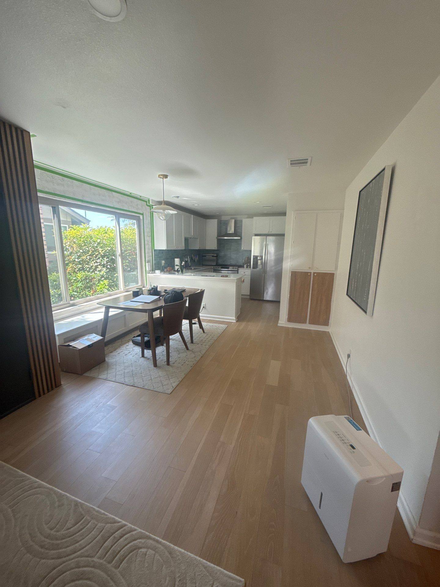 Kitchen and dining area in a home on W Braker Ln in Austin, TX ahead of interior painting by Hill Country Painting