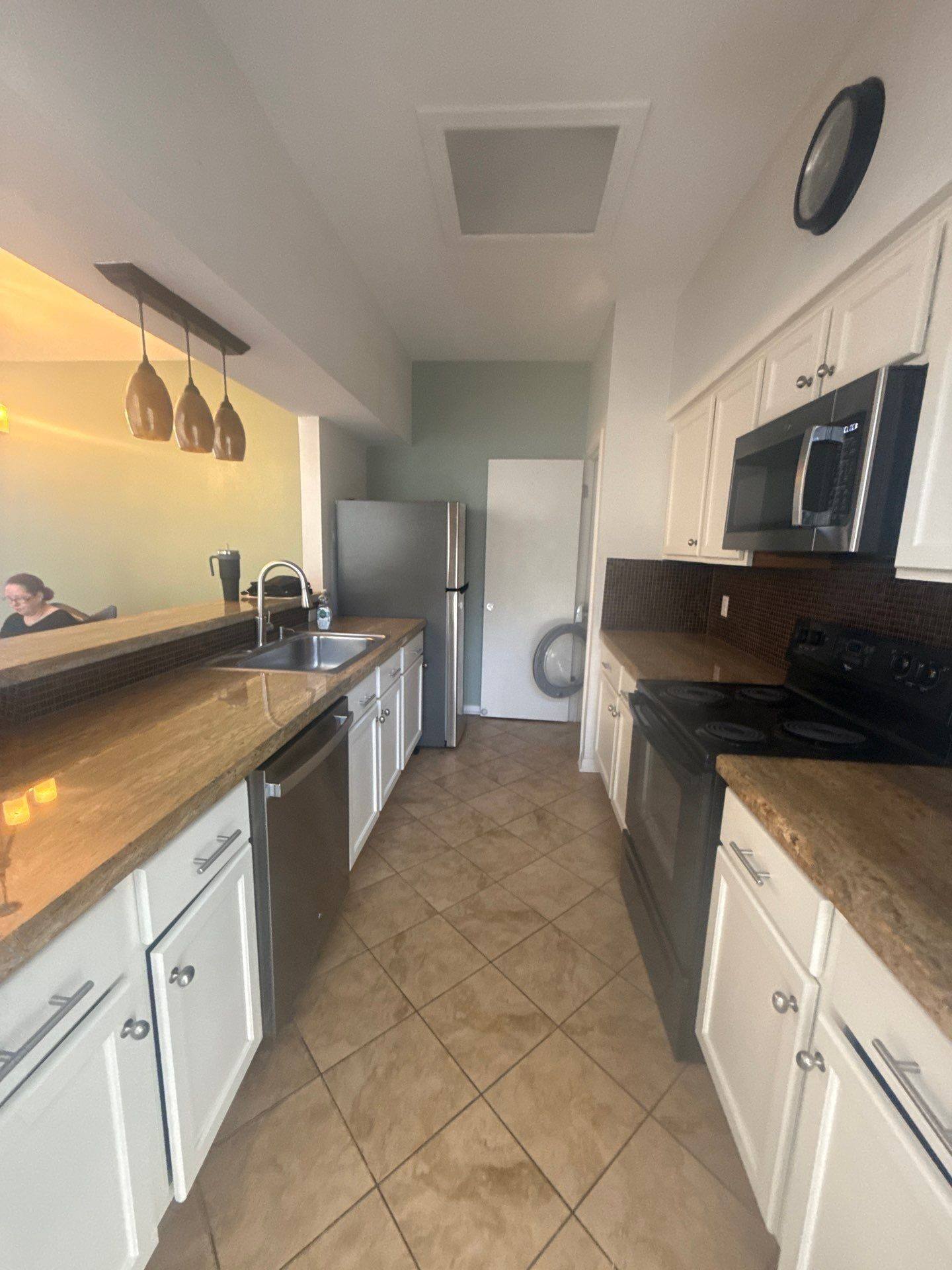 Kitchen in a home on Robbins Pl in Austin, TX ahead of interior painting by Hill Country Painting