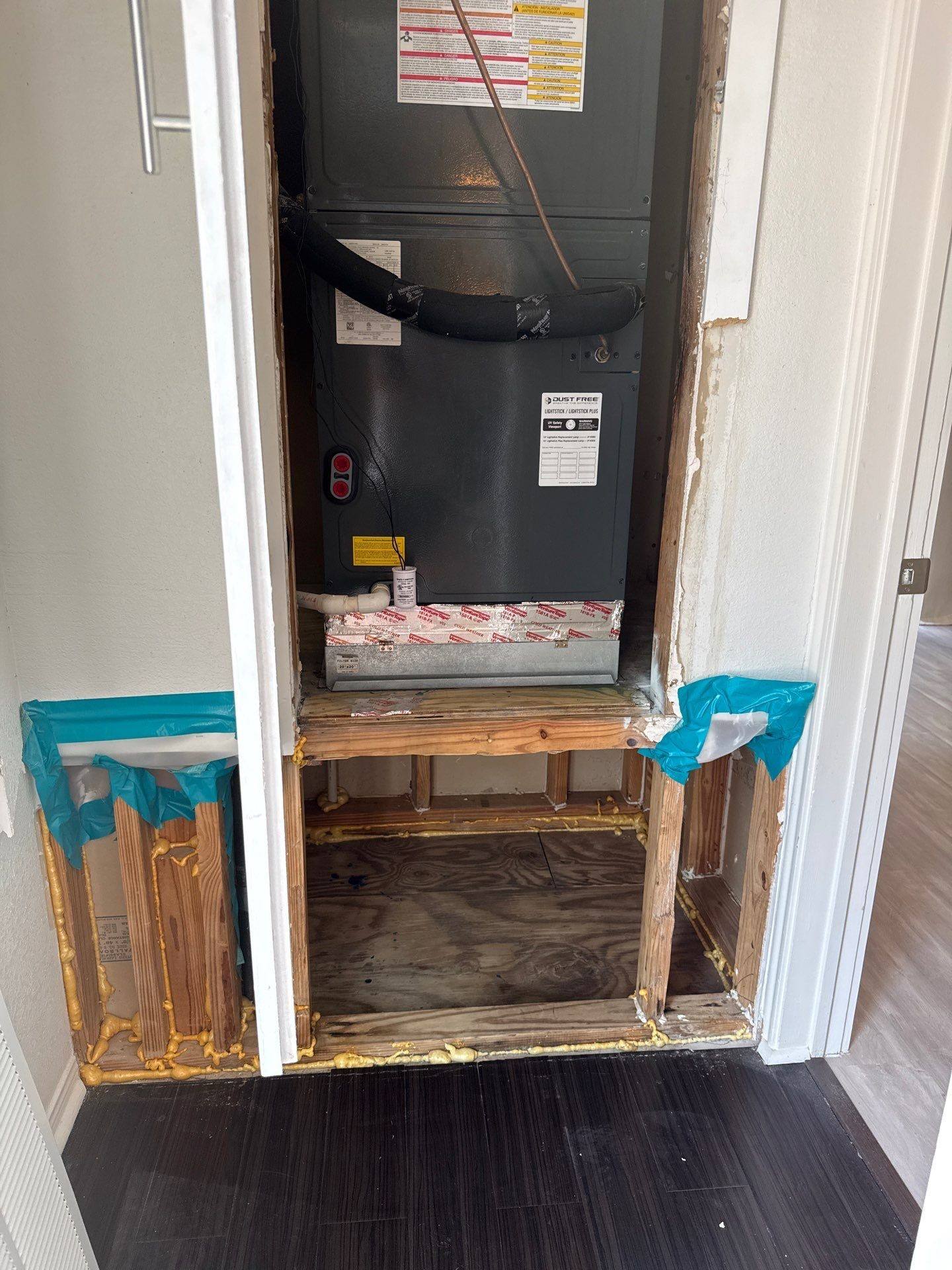 Hallway and utility closet area in a home on Robbins Pl in Austin, TX ahead of interior painting and drywall repair by Hill Country Painting