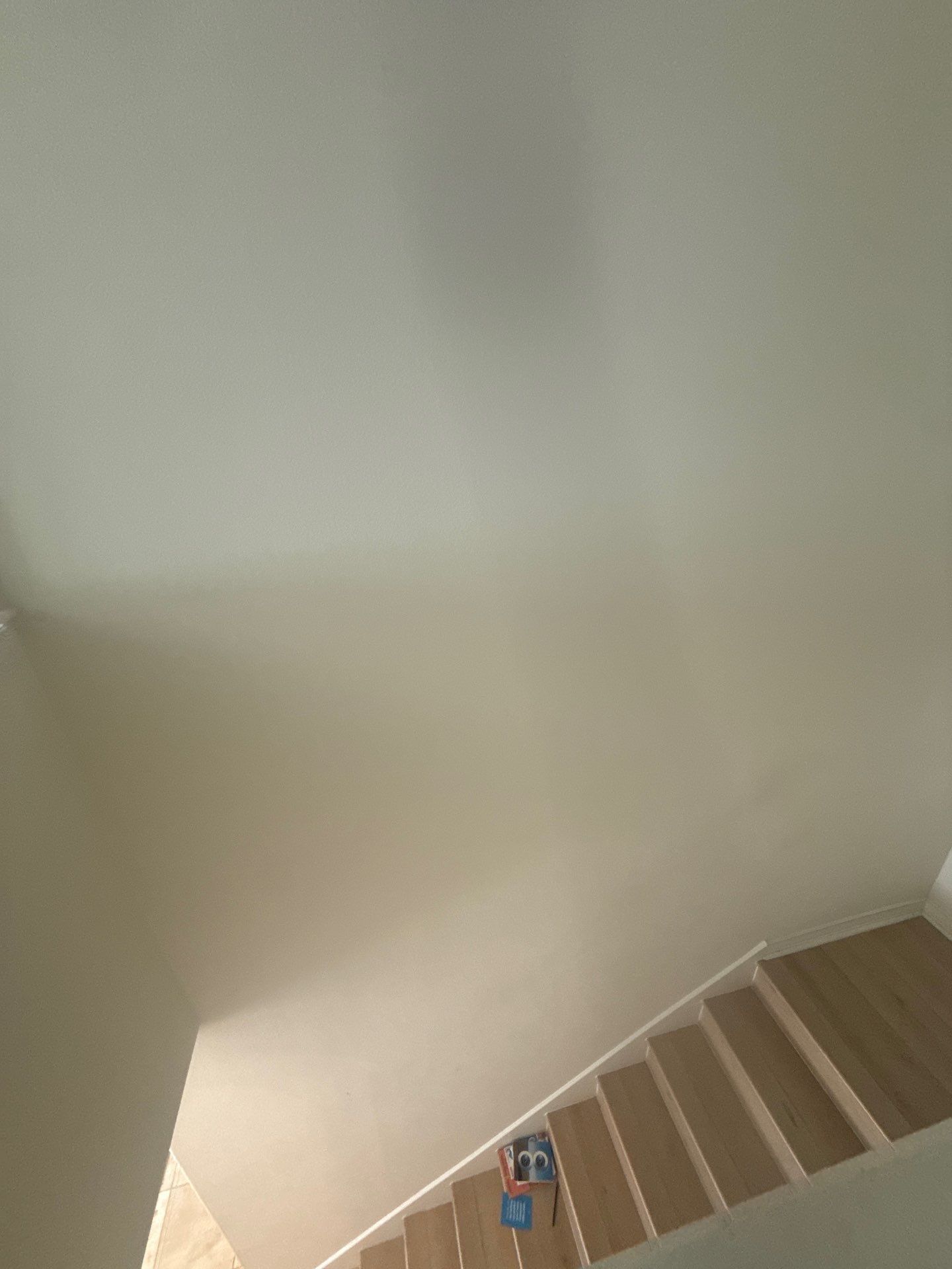 Stairwell in a home on Winnipeg Cove in Austin, TX ahead of interior painting by Hill Country Painting