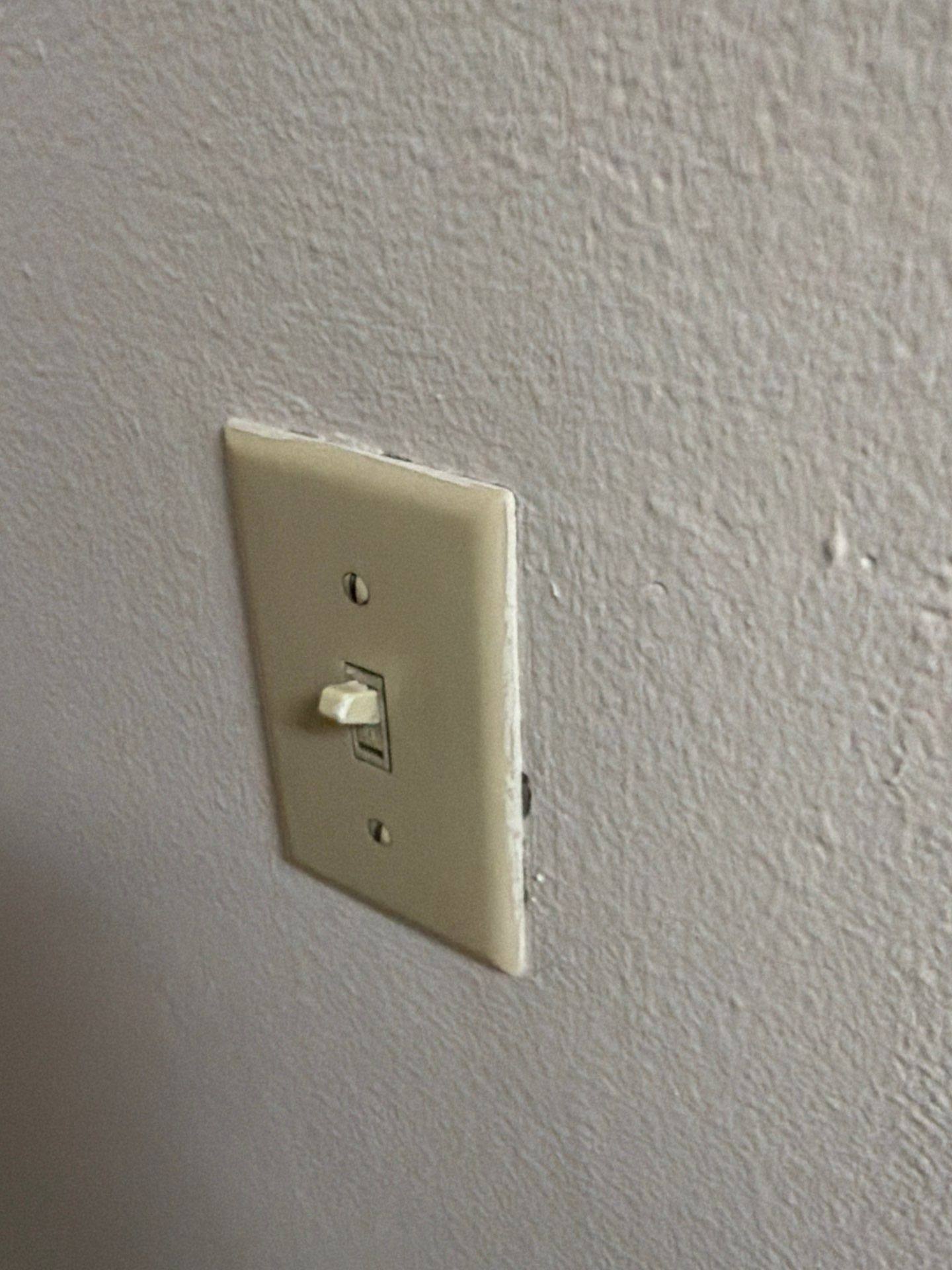 Wall switch cover at a property on St Stephens Dr in Austin, TX ahead of interior trim and outlet painting by Hill Country Painting