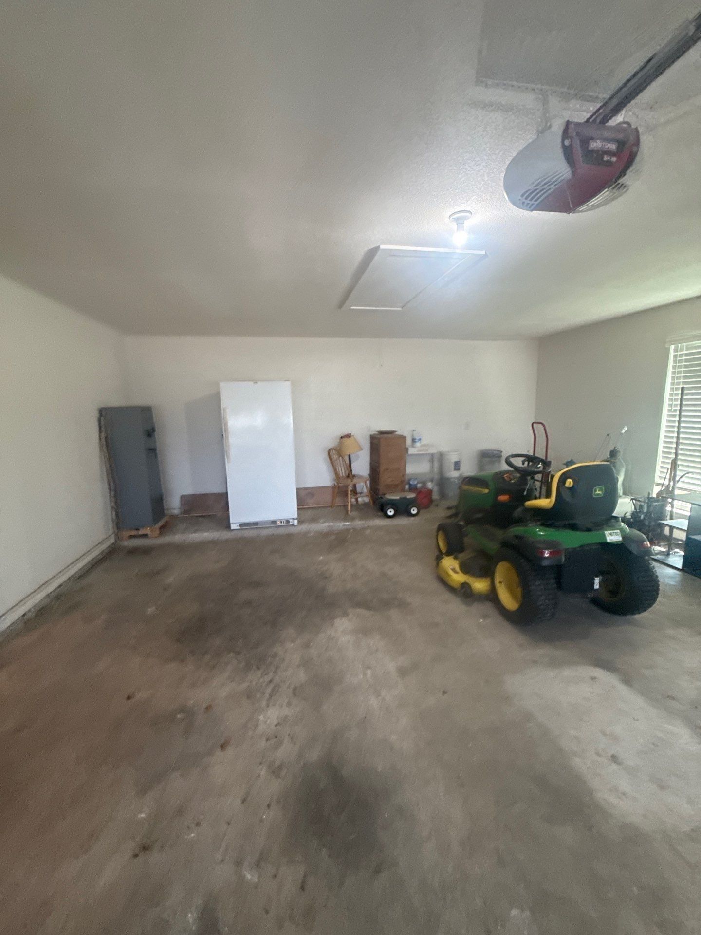 Garage interior at a property on Co Rd 120 in Georgetown, TX ahead of interior painting by Hill Country Painting