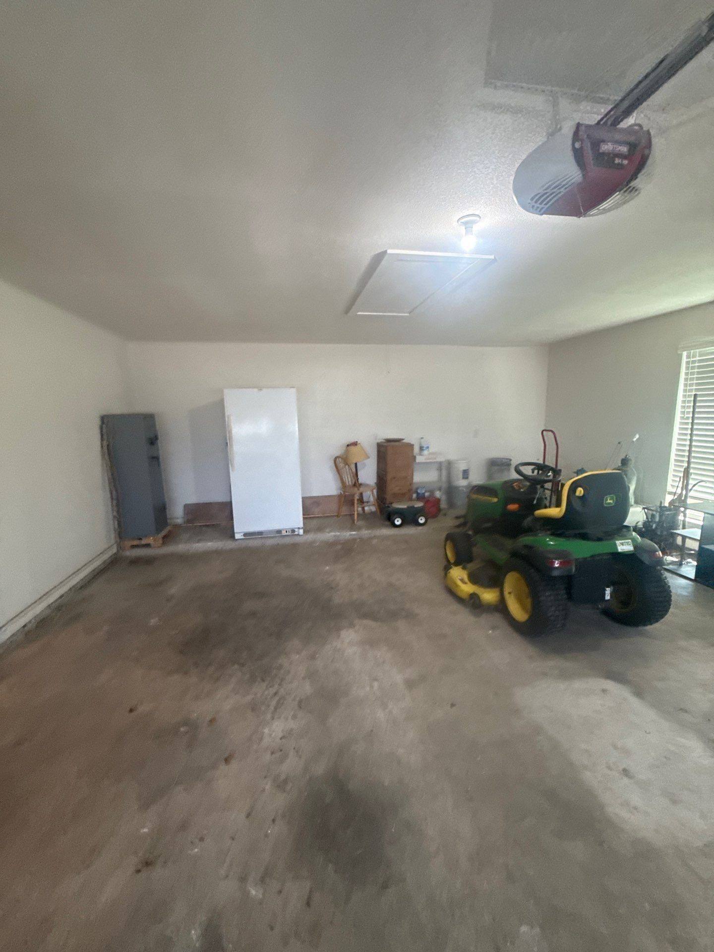 Garage interior at a property on Co Rd 120 in Georgetown, TX ahead of interior painting by Hill Country Painting
