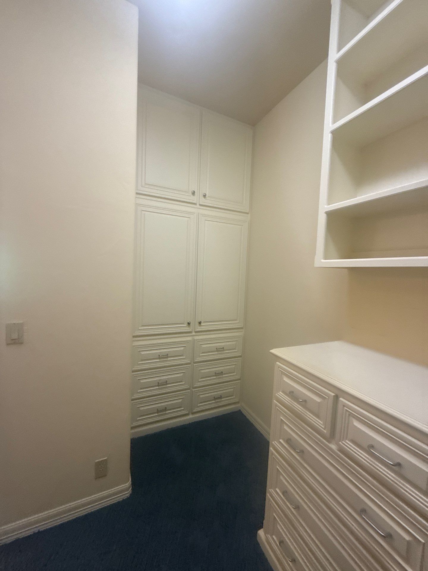 Master closet with built-in cabinetry at a property on Lakeway Hills Cv in Lakeway, TX ahead of whole-home interior painting by Hill Country Painting