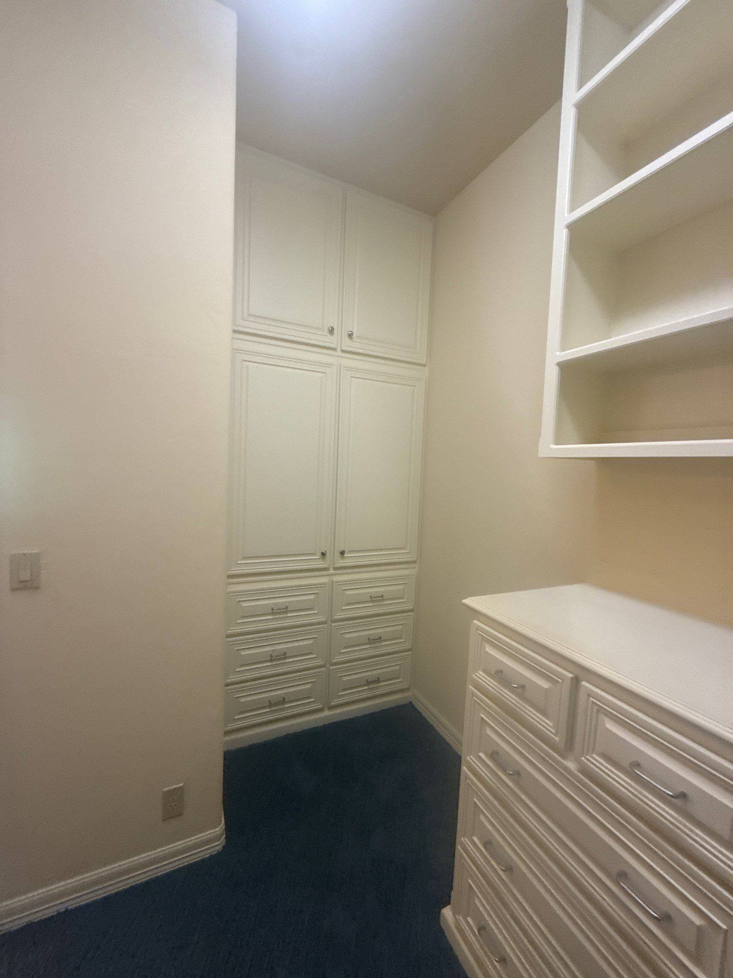 Master closet with built-in cabinetry at a property on Lakeway Hills Cv in Lakeway, TX ahead of whole-home interior painting by Hill Country Painting