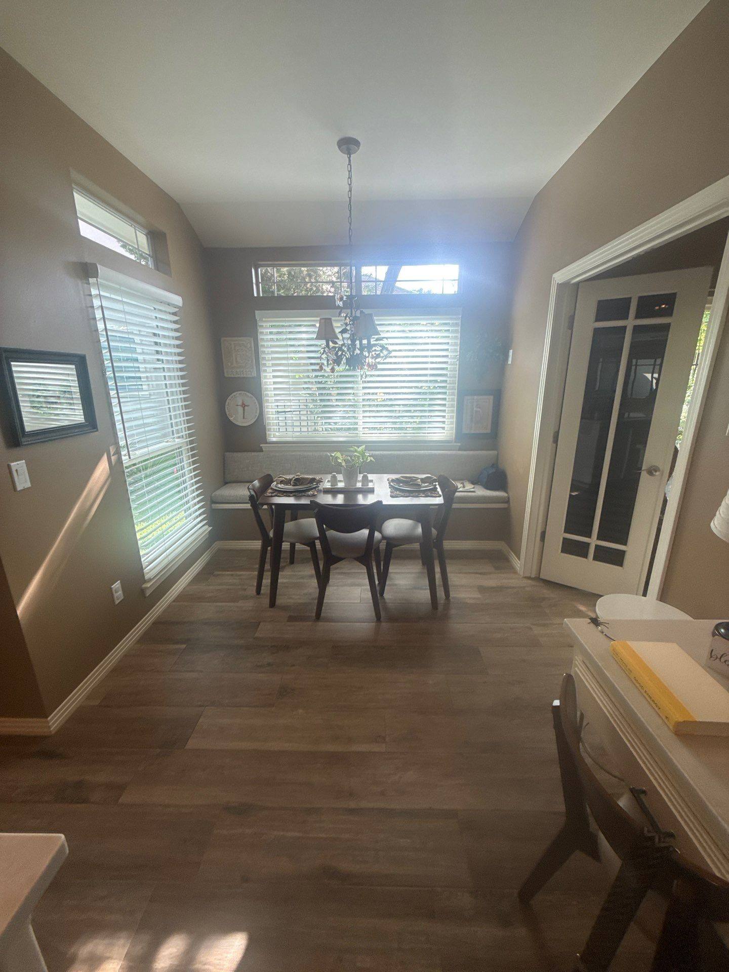 Dining nook with window seating at a property on Nautilus Ave in Lakeway, TX ahead of interior painting by Hill Country Painting