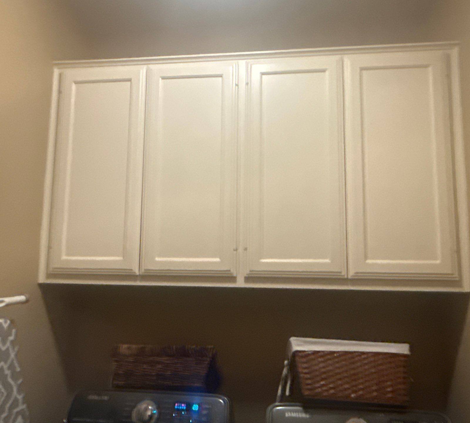 Laundry room cabinetry at a property on Nautilus Ave in Lakeway, TX ahead of interior painting by Hill Country Painting