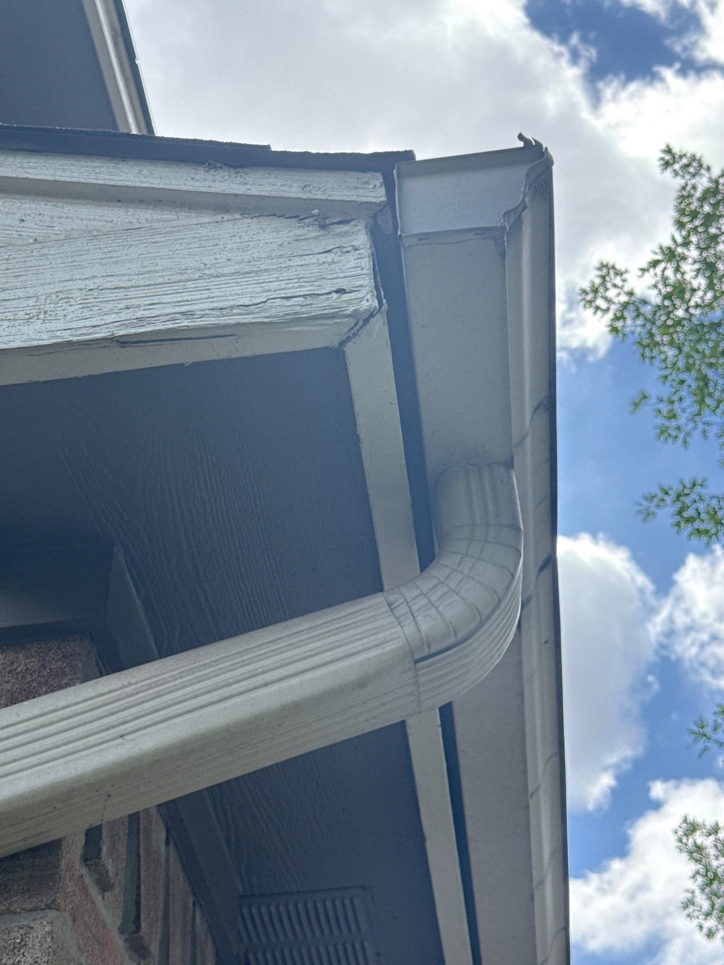 Gutter and downspout at a property on Sarong Way in Austin, TX ahead of exterior painting by Hill Country Painting