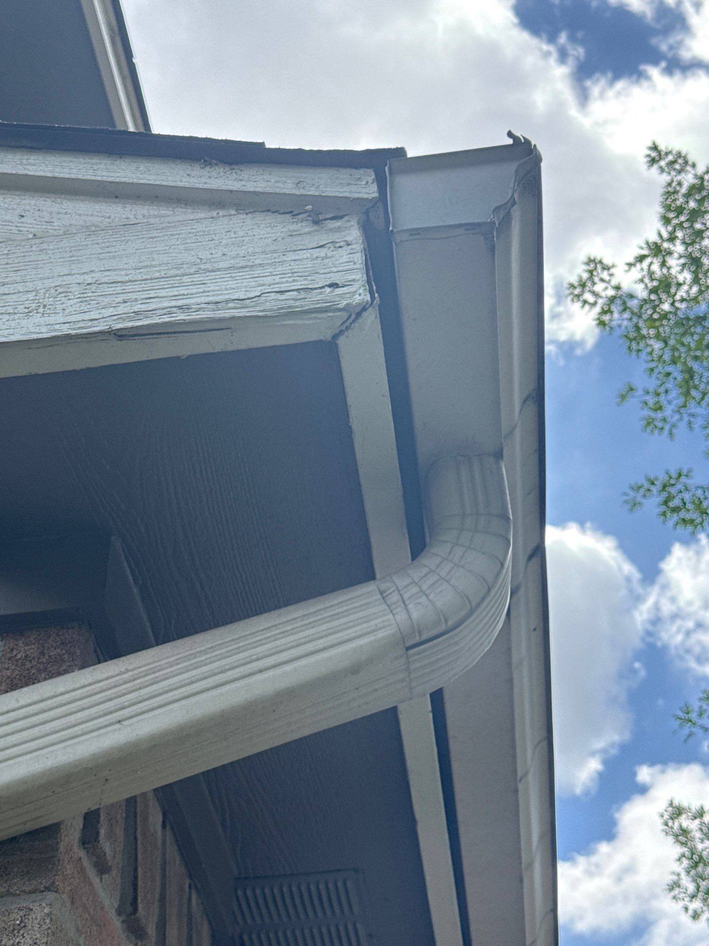 Gutter and downspout at a property on Sarong Way in Austin, TX ahead of exterior painting by Hill Country Painting