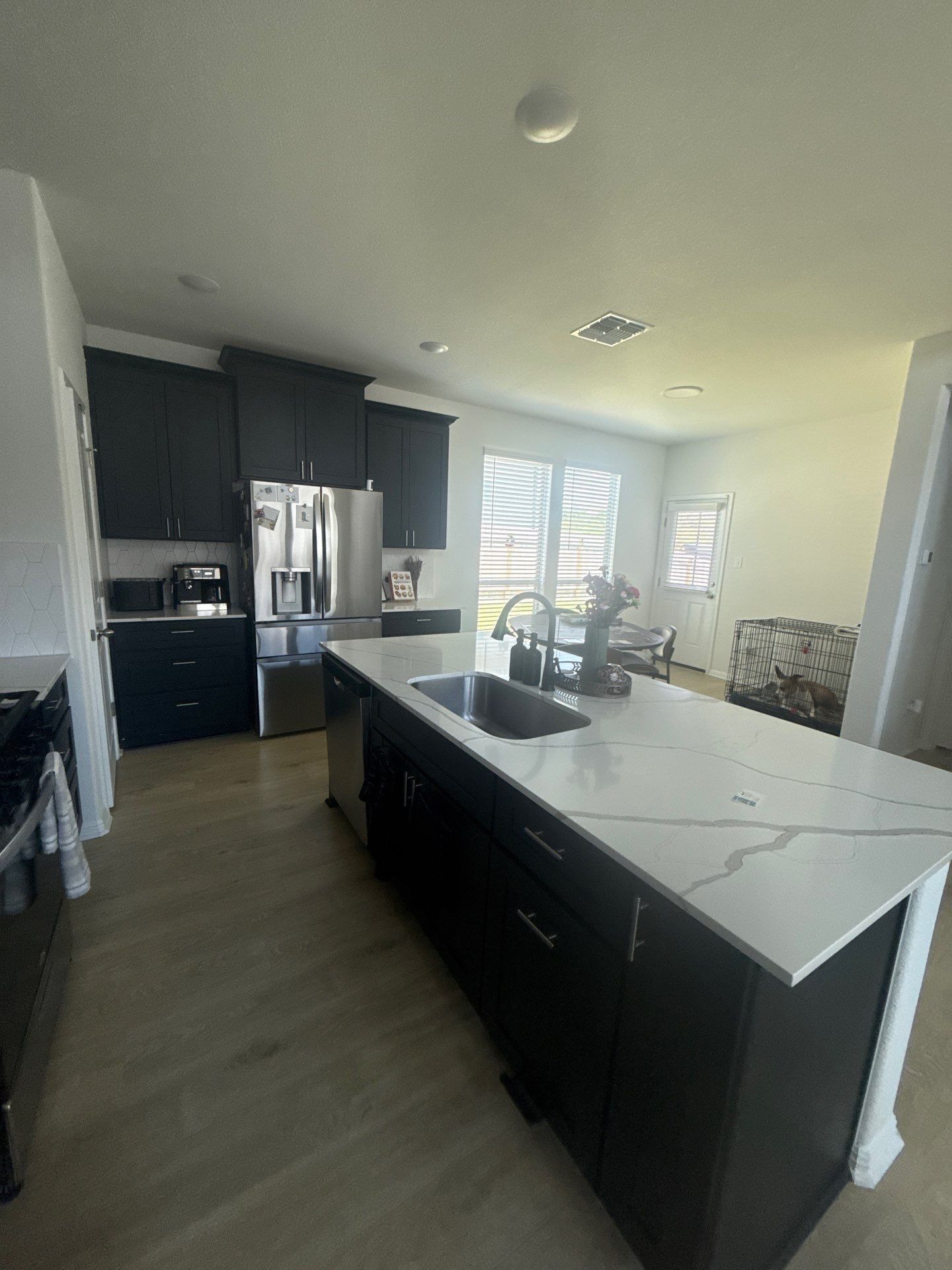 Kitchen and dining area at a property on Halas St in Manchaca, TX ahead of interior painting by Hill Country Painting