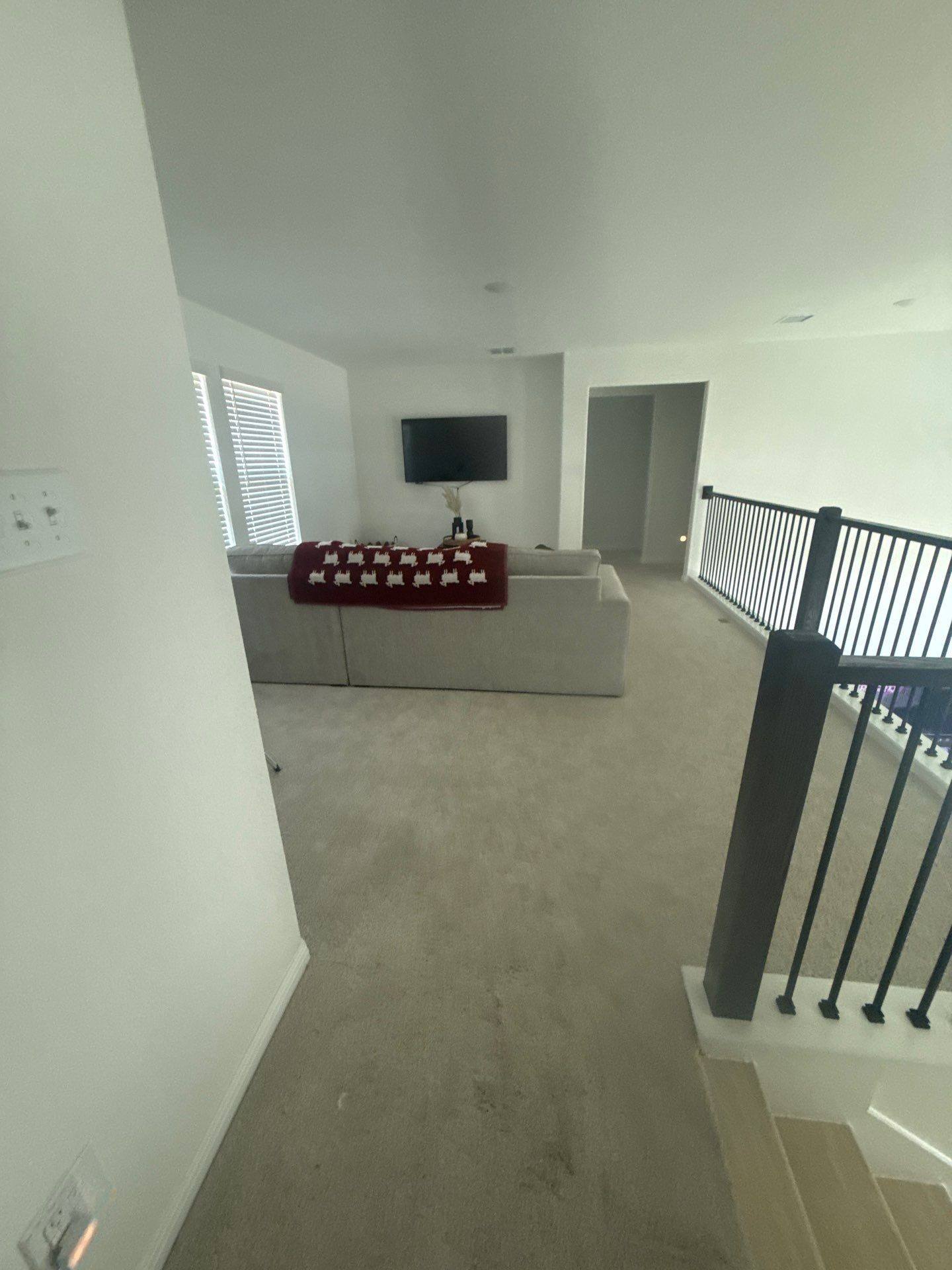 Living room at a property on Halas St in Manchaca, TX ahead of interior painting by Hill Country Painting