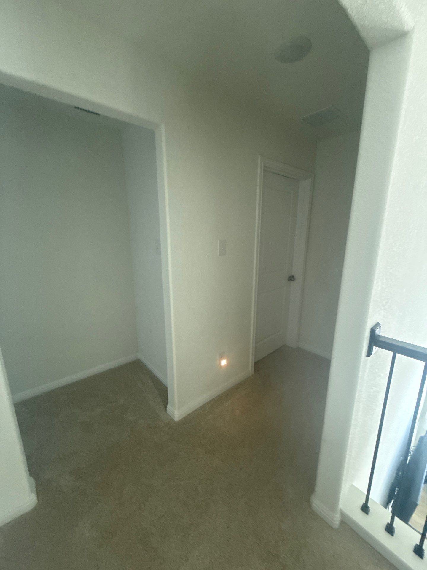 Hallway at a property on Halas St in Manchaca, TX ahead of interior painting by Hill Country Painting