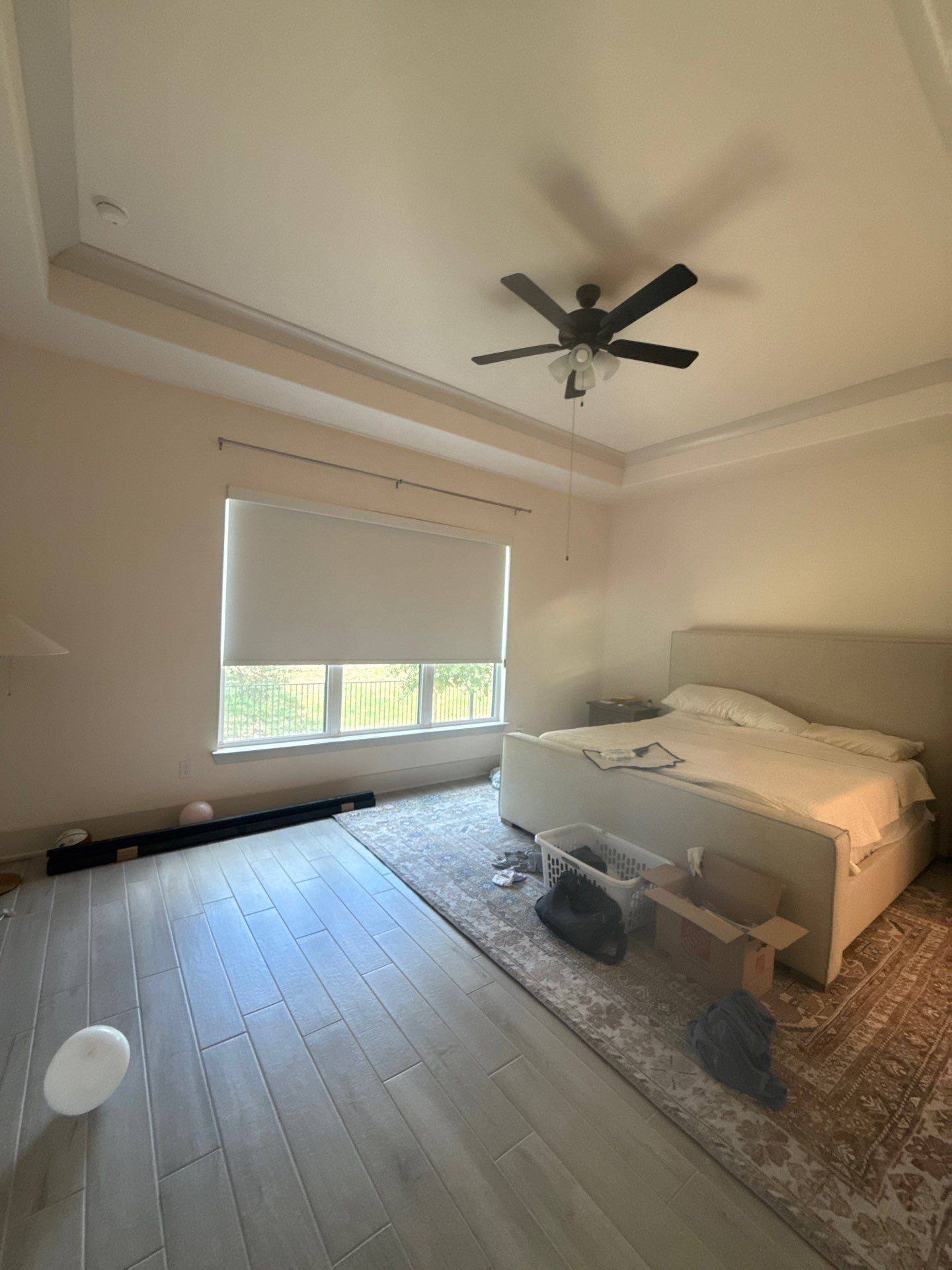 Bedroom at a property on Rawson Bend in Lakeway, TX ahead of interior painting by Hill Country Painting