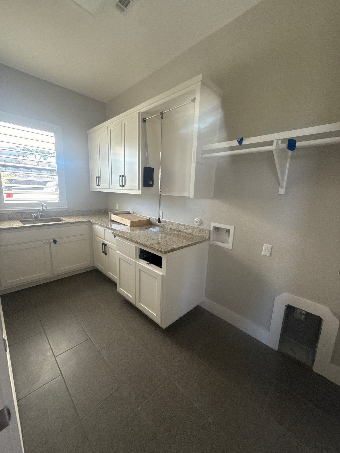 Laundry room at a property on Willow Hill Dr in Georgetown, TX ahead of interior painting by Hill Country Painting