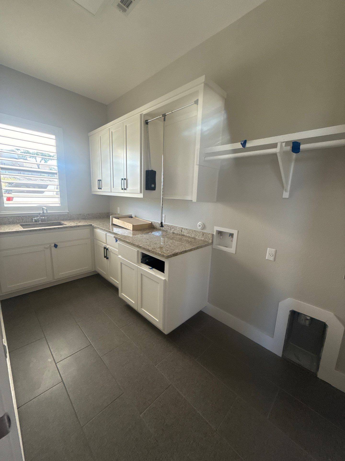 Laundry room at a property on Willow Hill Dr in Georgetown, TX ahead of interior painting by Hill Country Painting