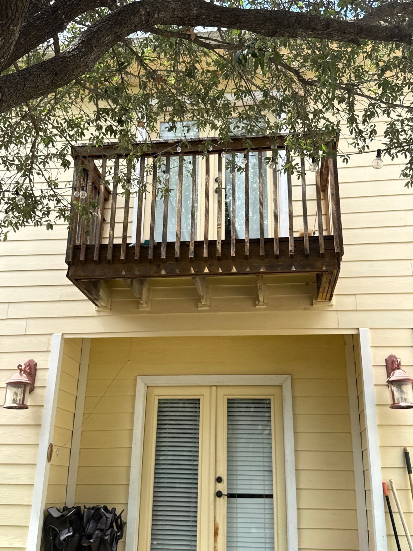 Exterior balcony and siding of the home ahead of painting