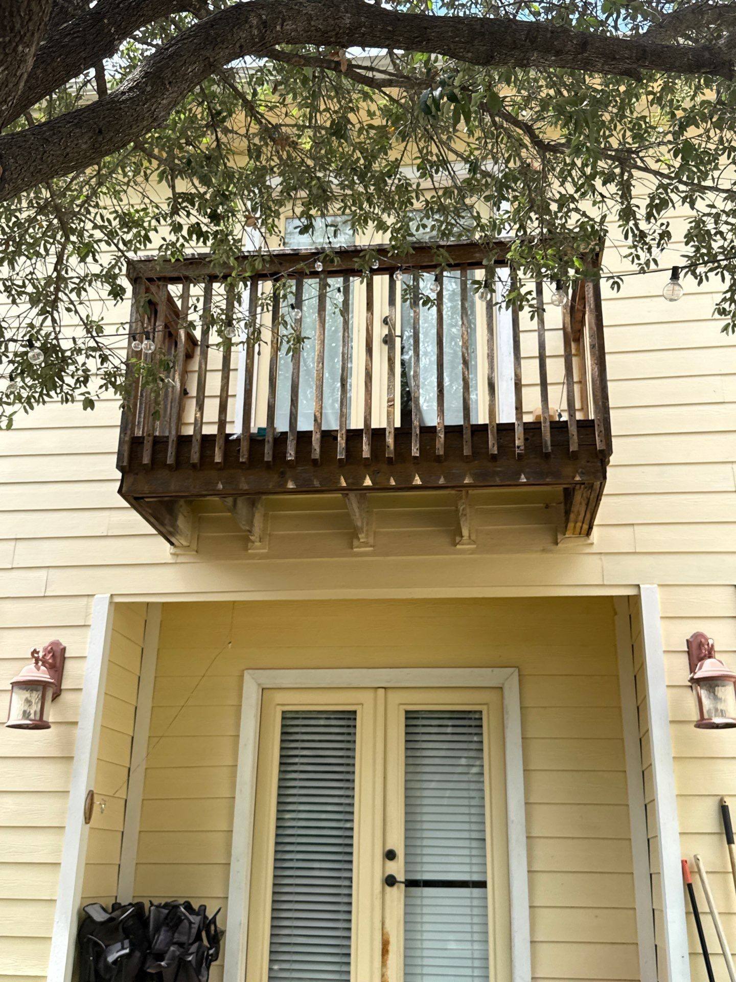 Exterior balcony and siding of the home ahead of painting