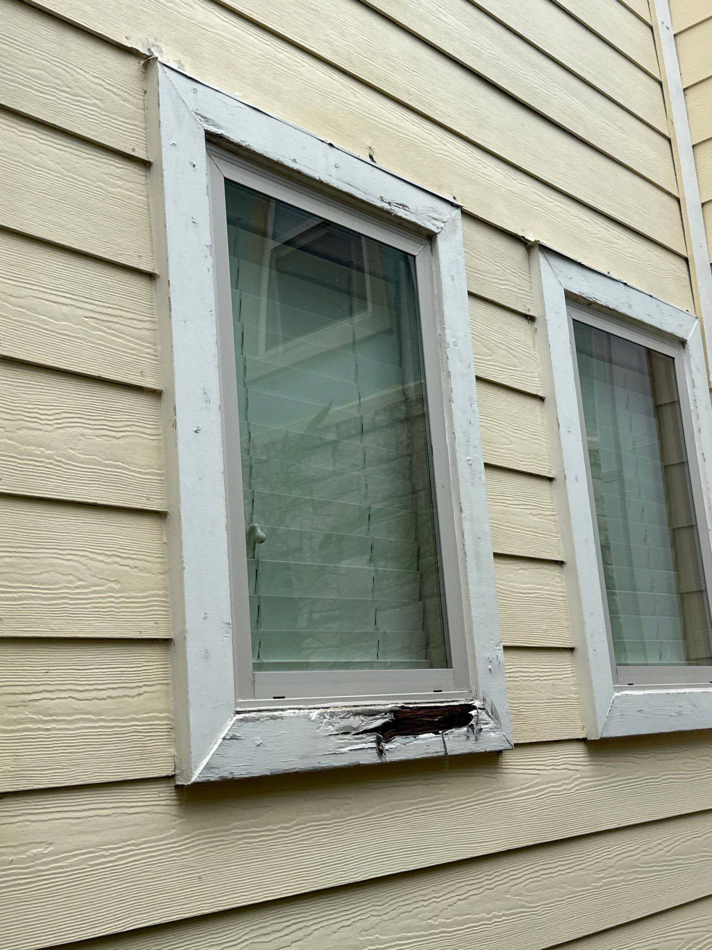Window trim showing wood damage ahead of repair and painting