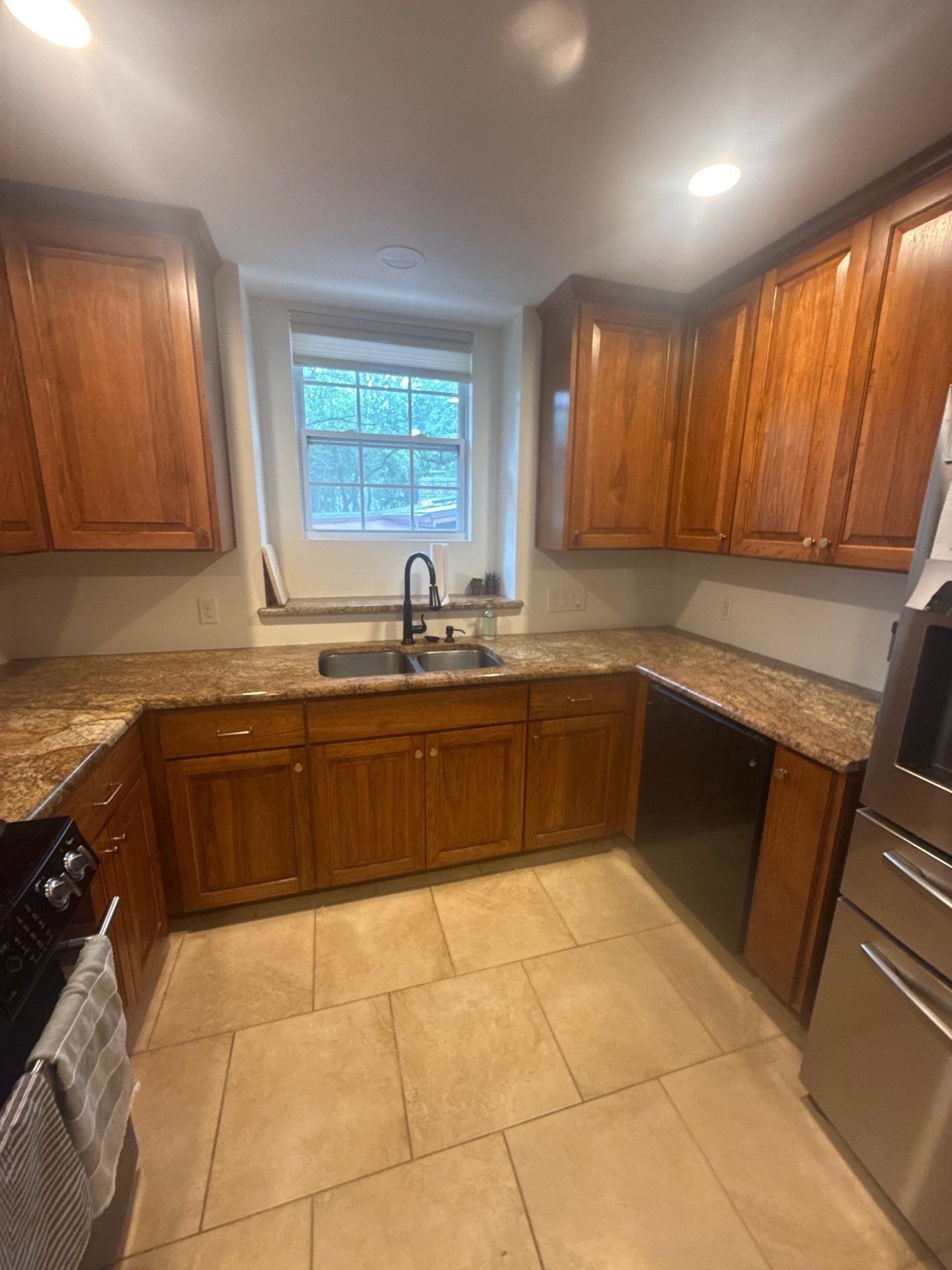 Kitchen cabinets and sink area ahead of painting