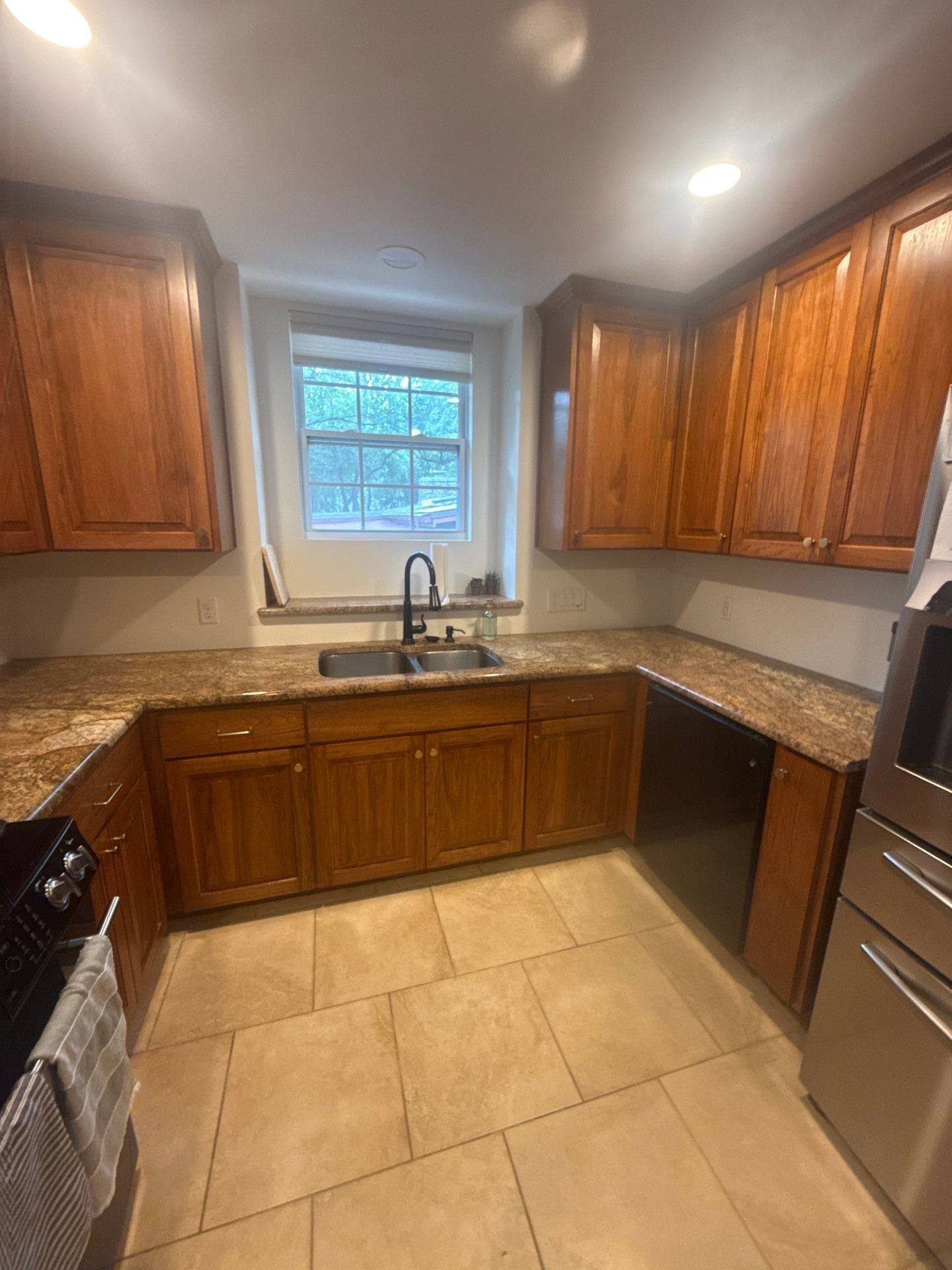Kitchen cabinets and sink area ahead of painting