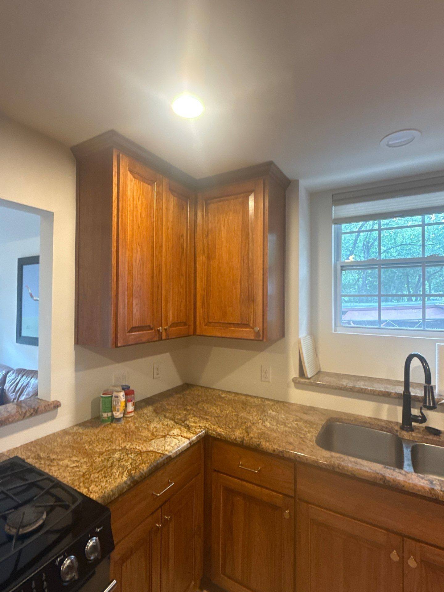 Corner upper kitchen cabinets ahead of painting