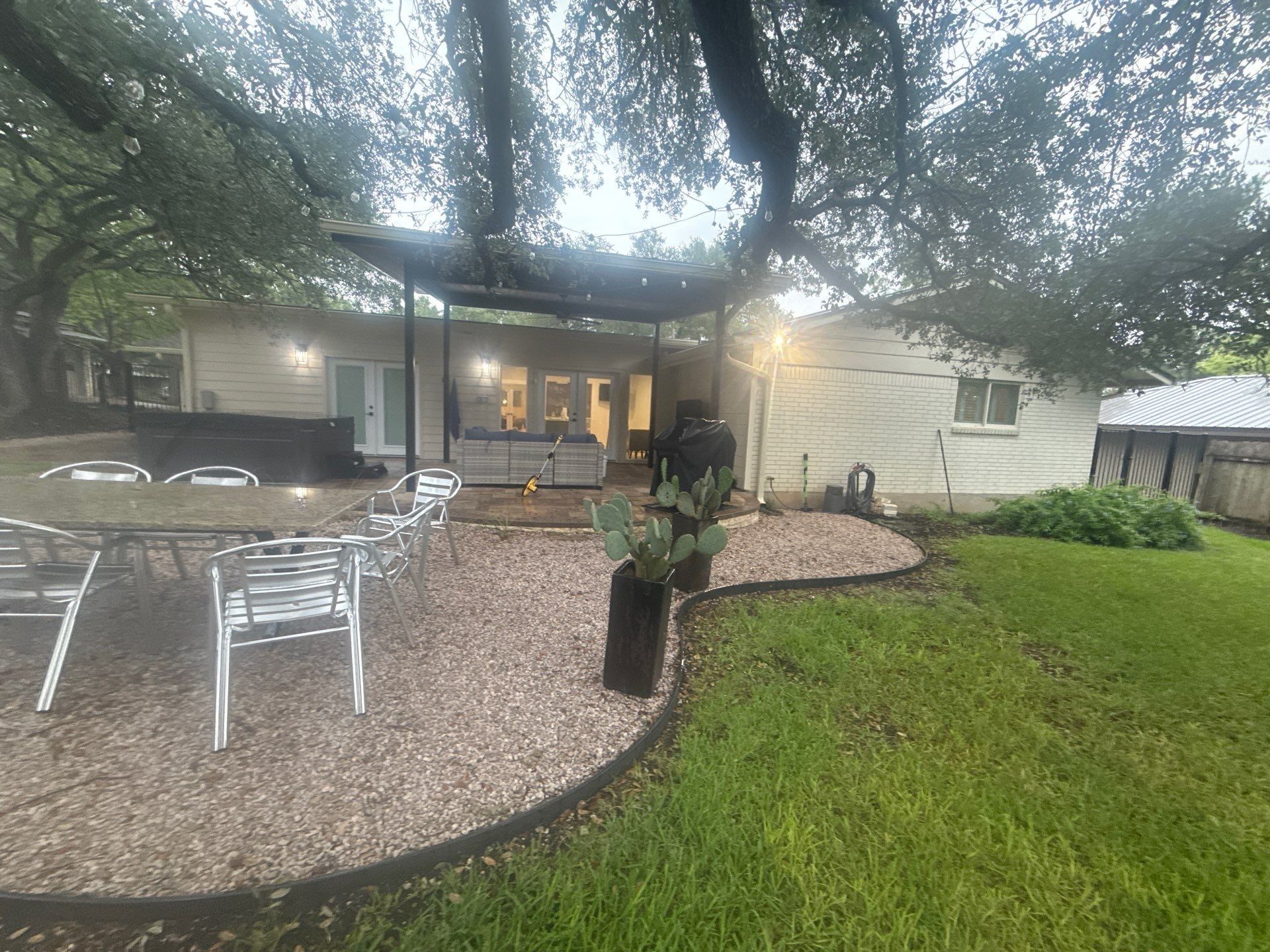 Backyard patio and rear exterior of the home ahead of painting
