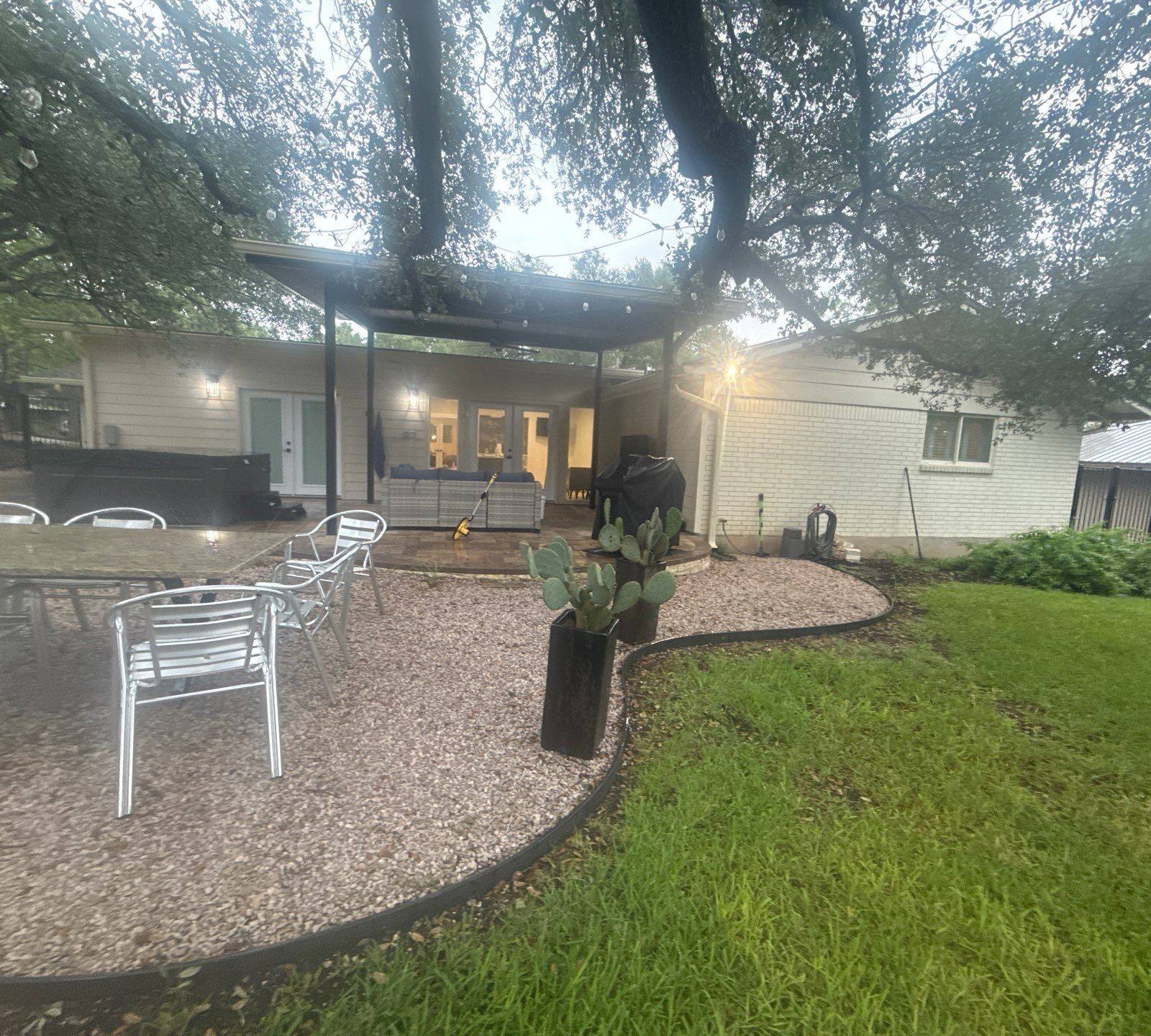 Backyard patio and rear exterior of the home ahead of painting