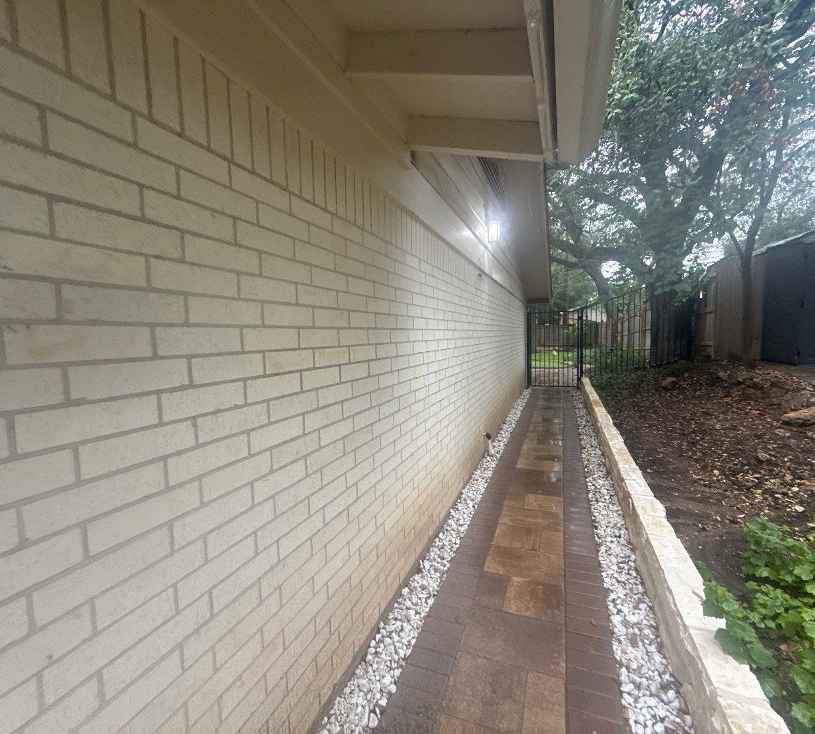 Side exterior walkway and soffit of the home ahead of painting