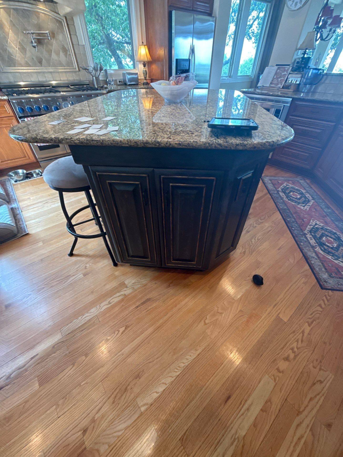 Kitchen island cabinets and granite counter ahead of painting
