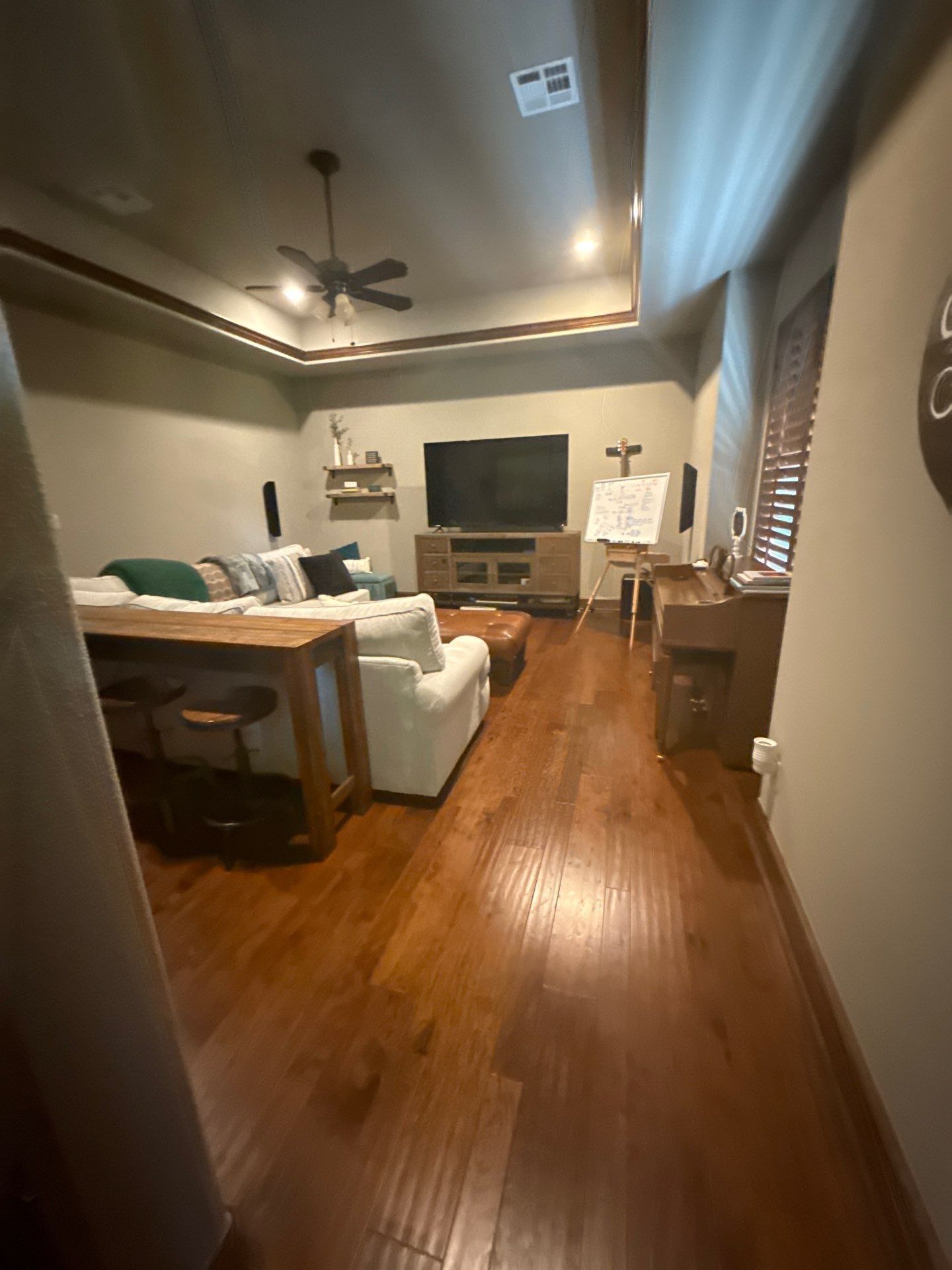 Living room with hardwood floors ahead of painting