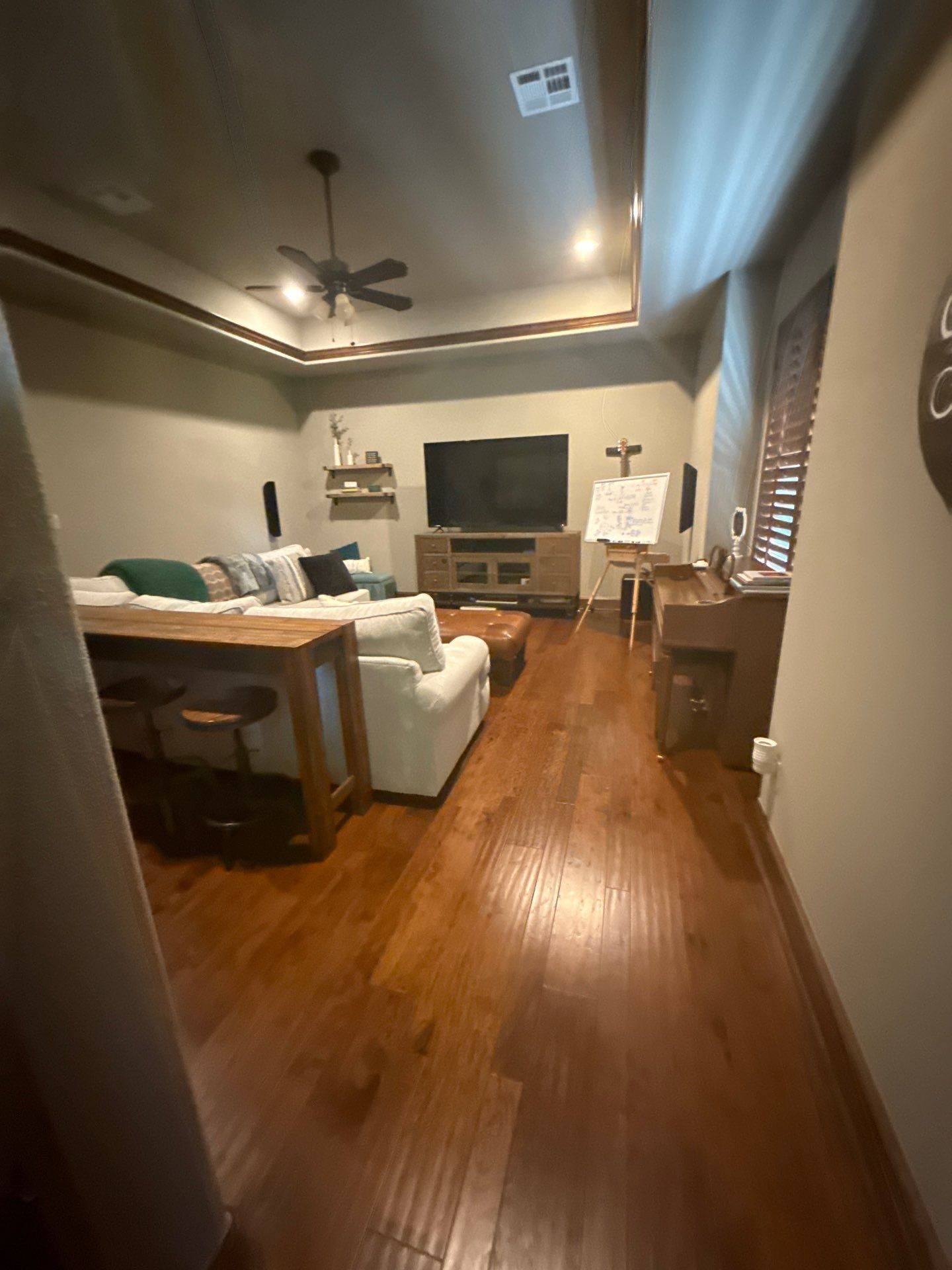 Living room with hardwood floors ahead of painting