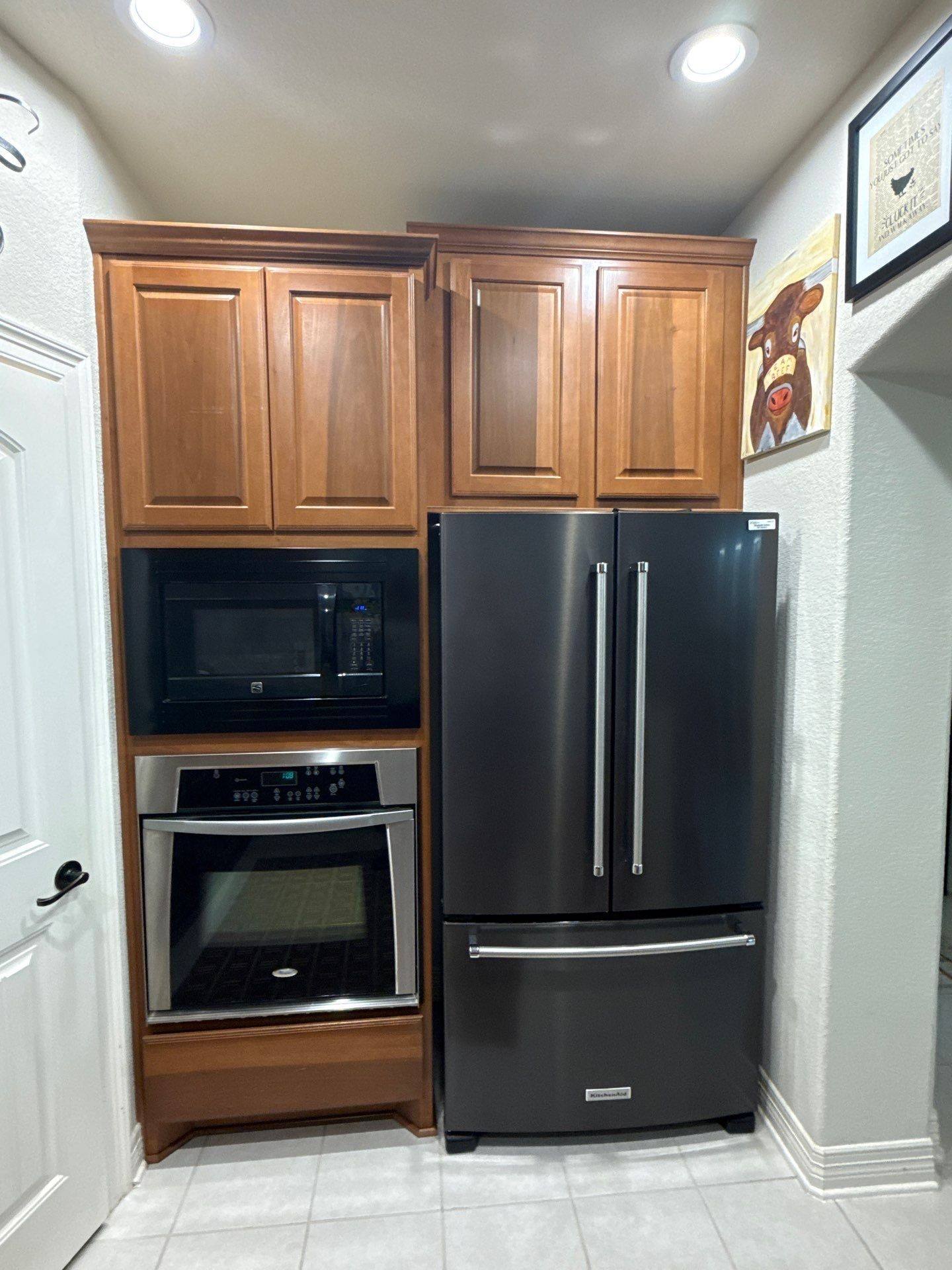Kitchen refrigerator surround cabinets ahead of painting