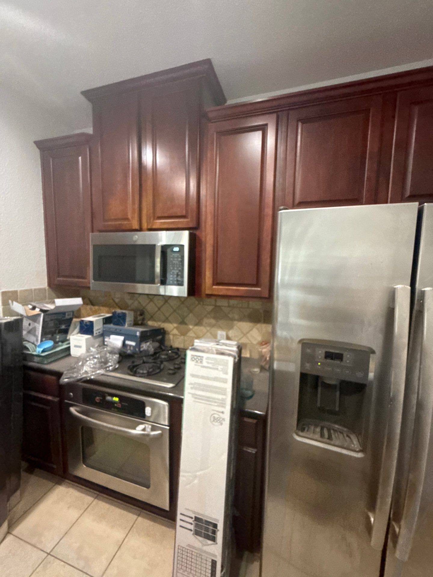 Kitchen cabinets and appliances ahead of painting