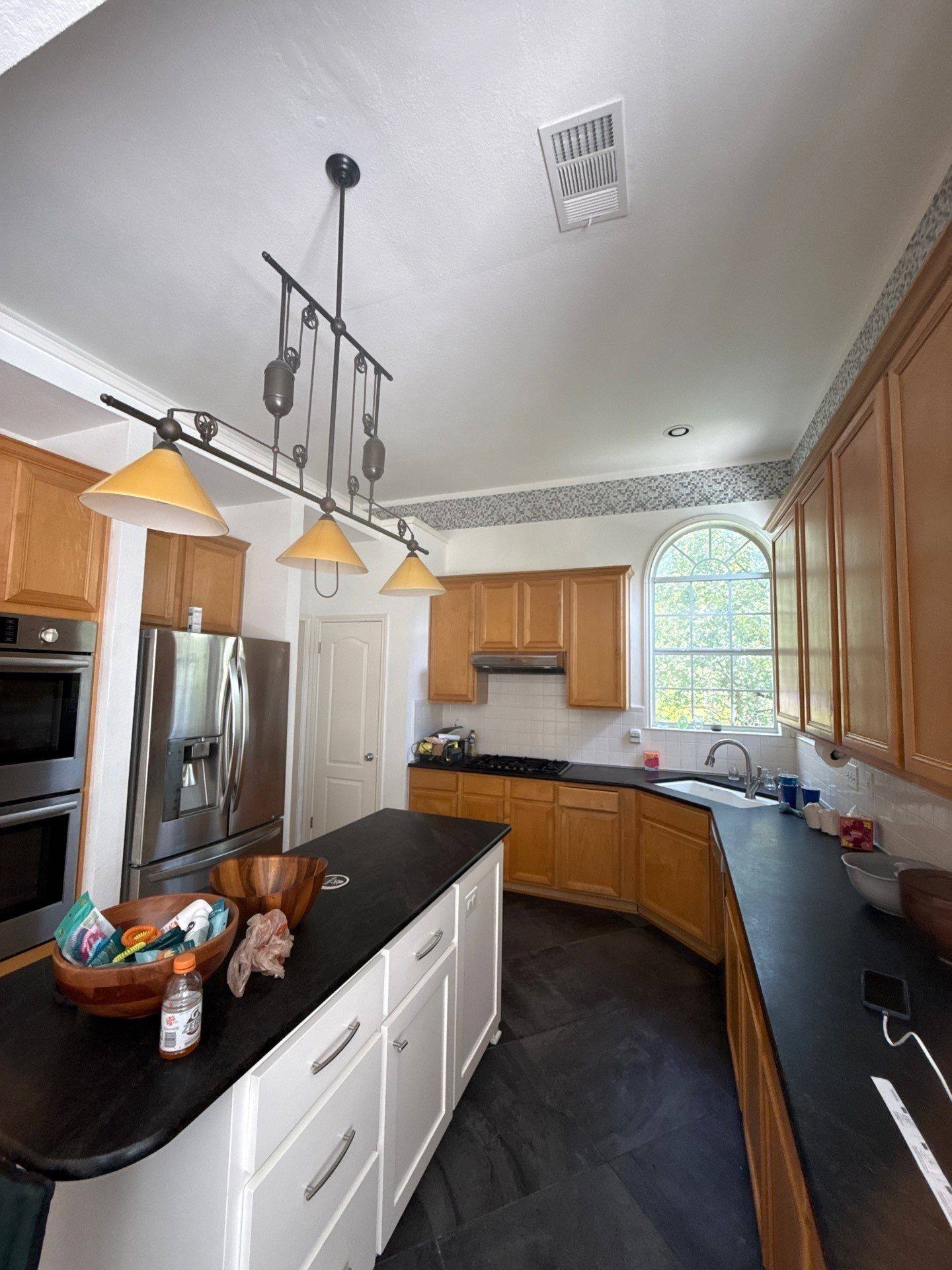 Kitchen with cabinetry, island, and breakfast nook