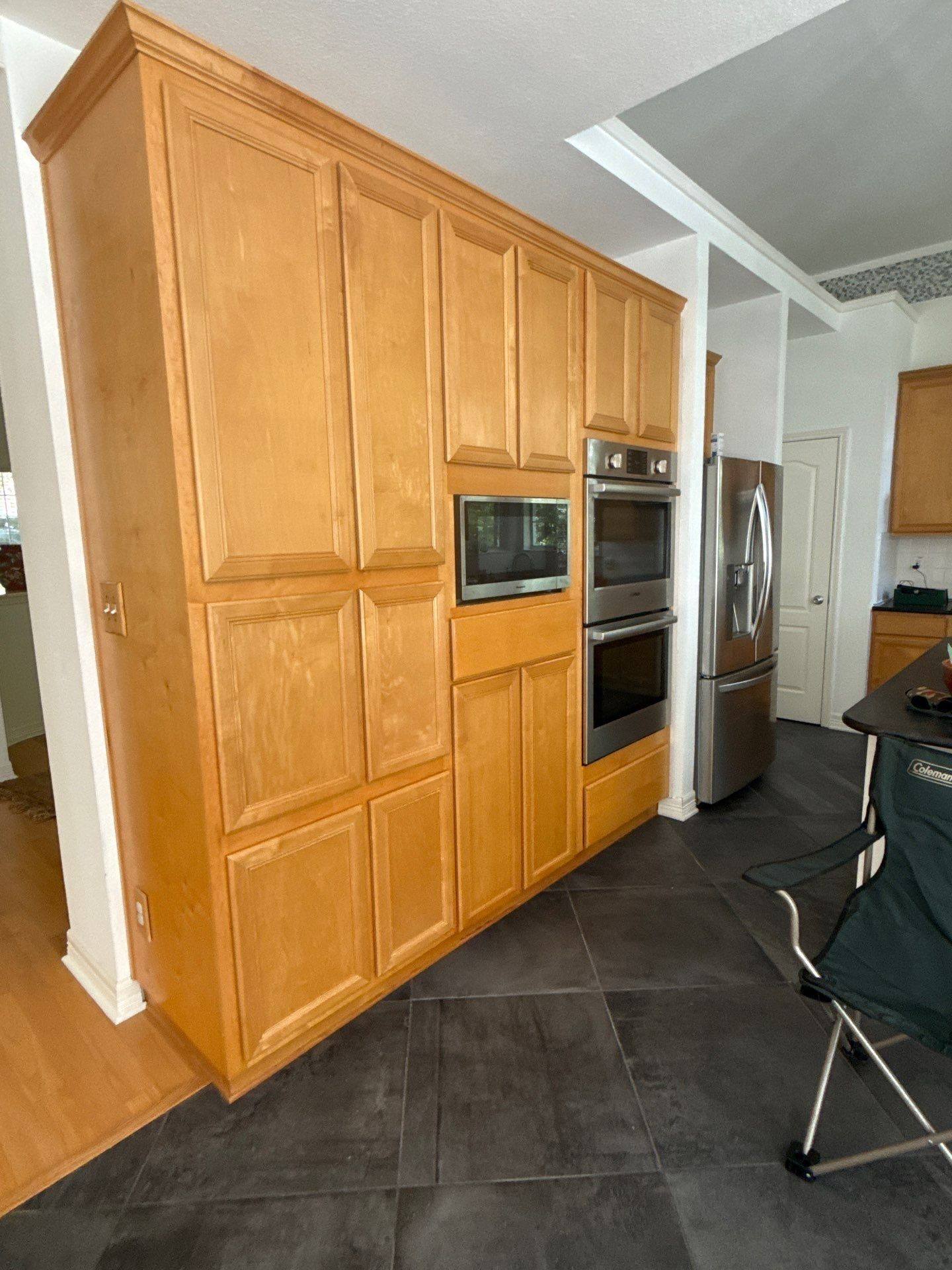 Kitchen pantry wall cabinets and built-in ovens