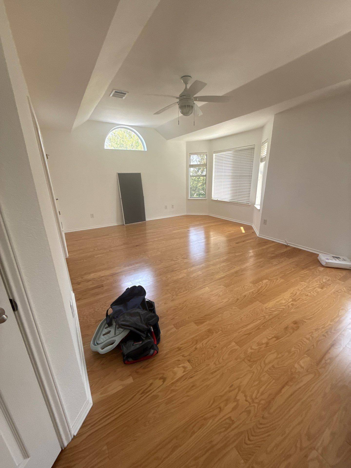Upstairs bedroom with vaulted ceiling and bay window