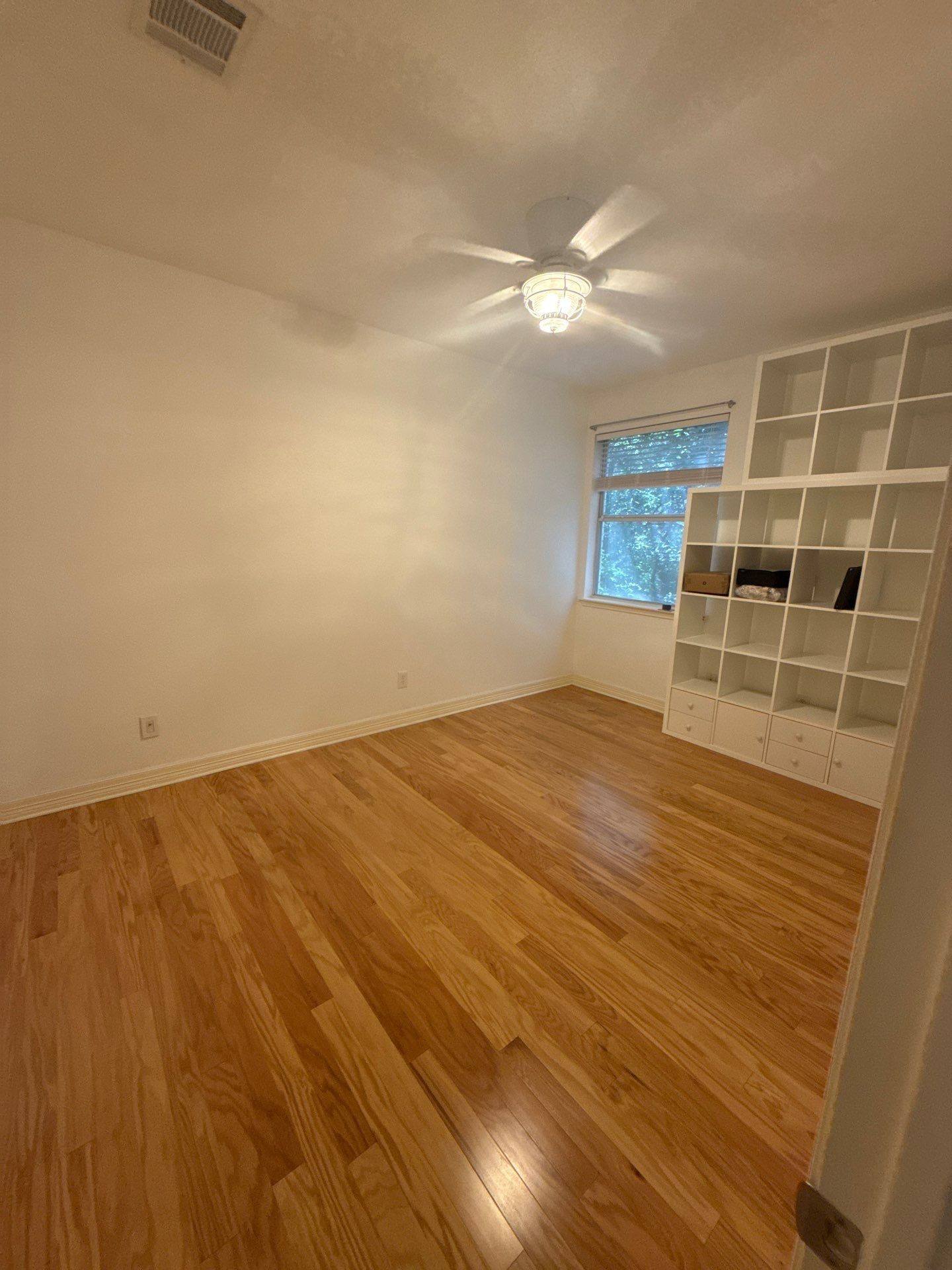Upstairs bedroom with built-in shelving