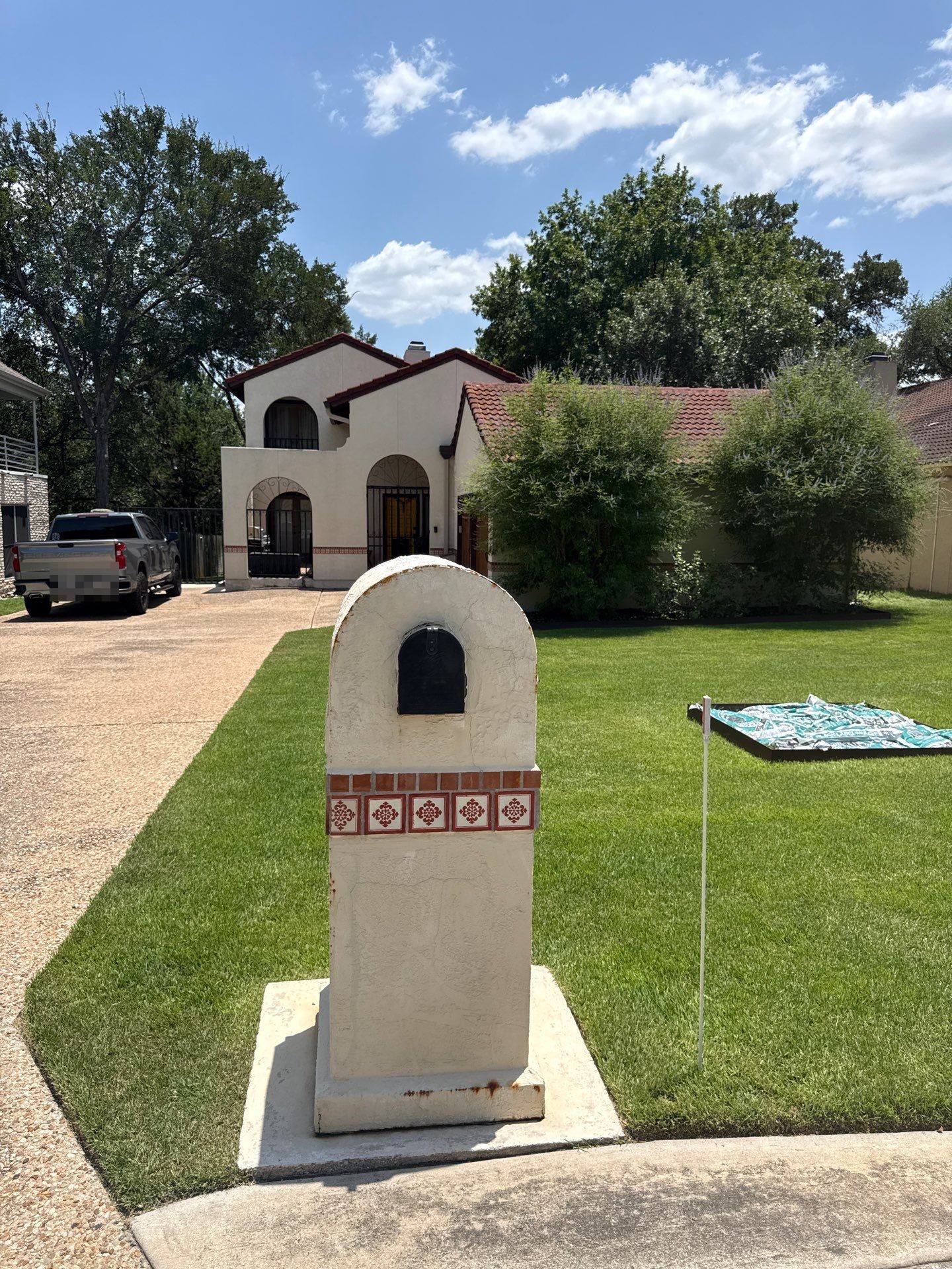 Front exterior view of the home with driveway