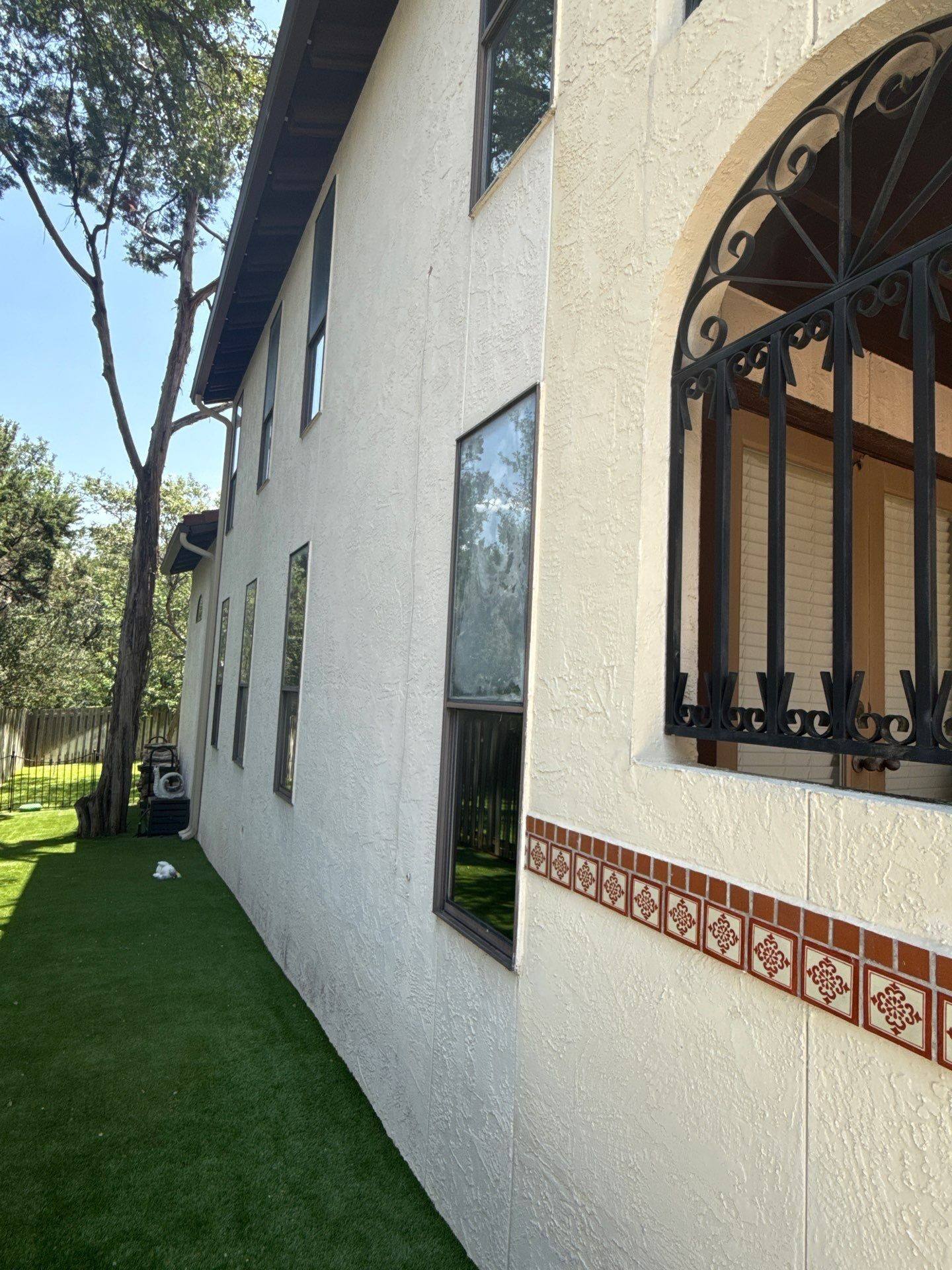 Side exterior wall with upstairs windows