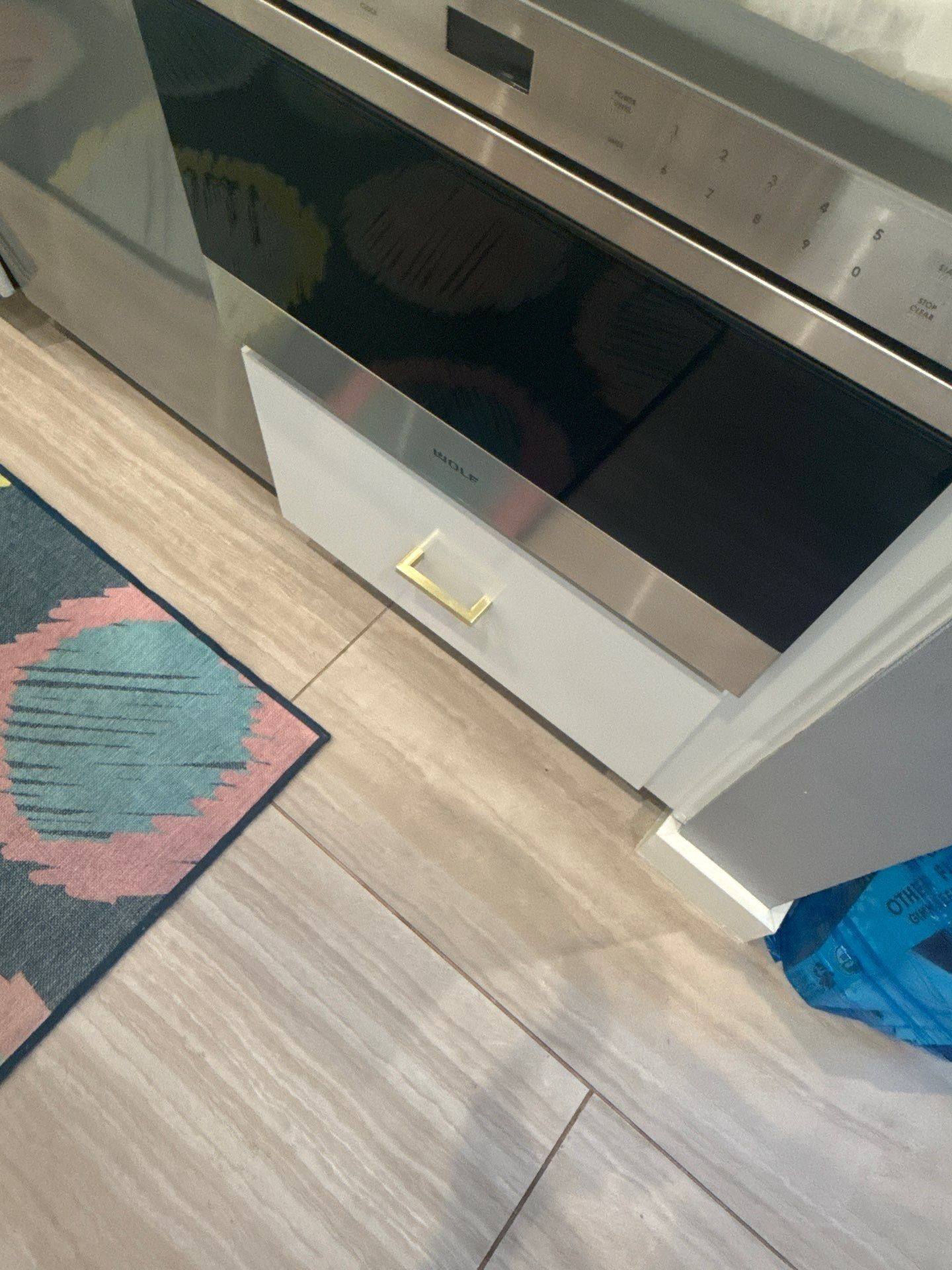 Close-up of a cabinet drawer near the oven ahead of painting