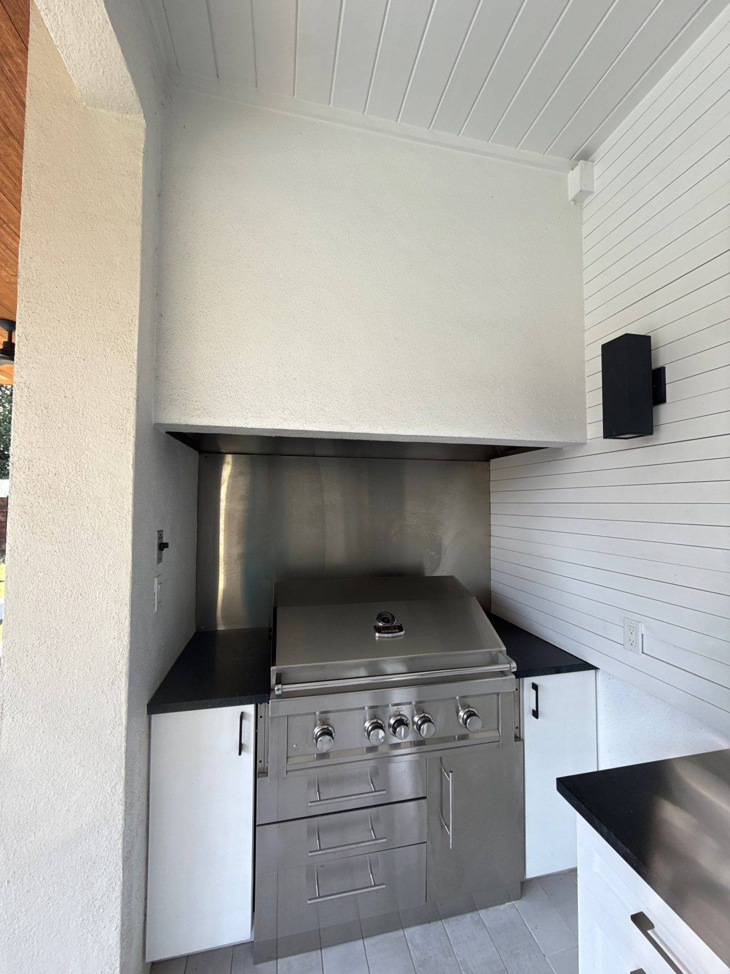 Outdoor kitchen and grill area ahead of painting