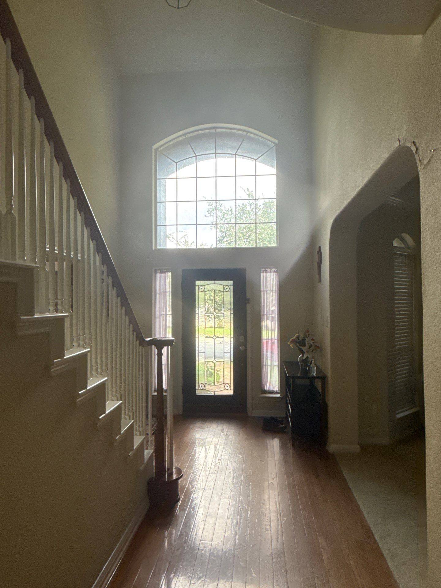 Entryway and front door ahead of painting