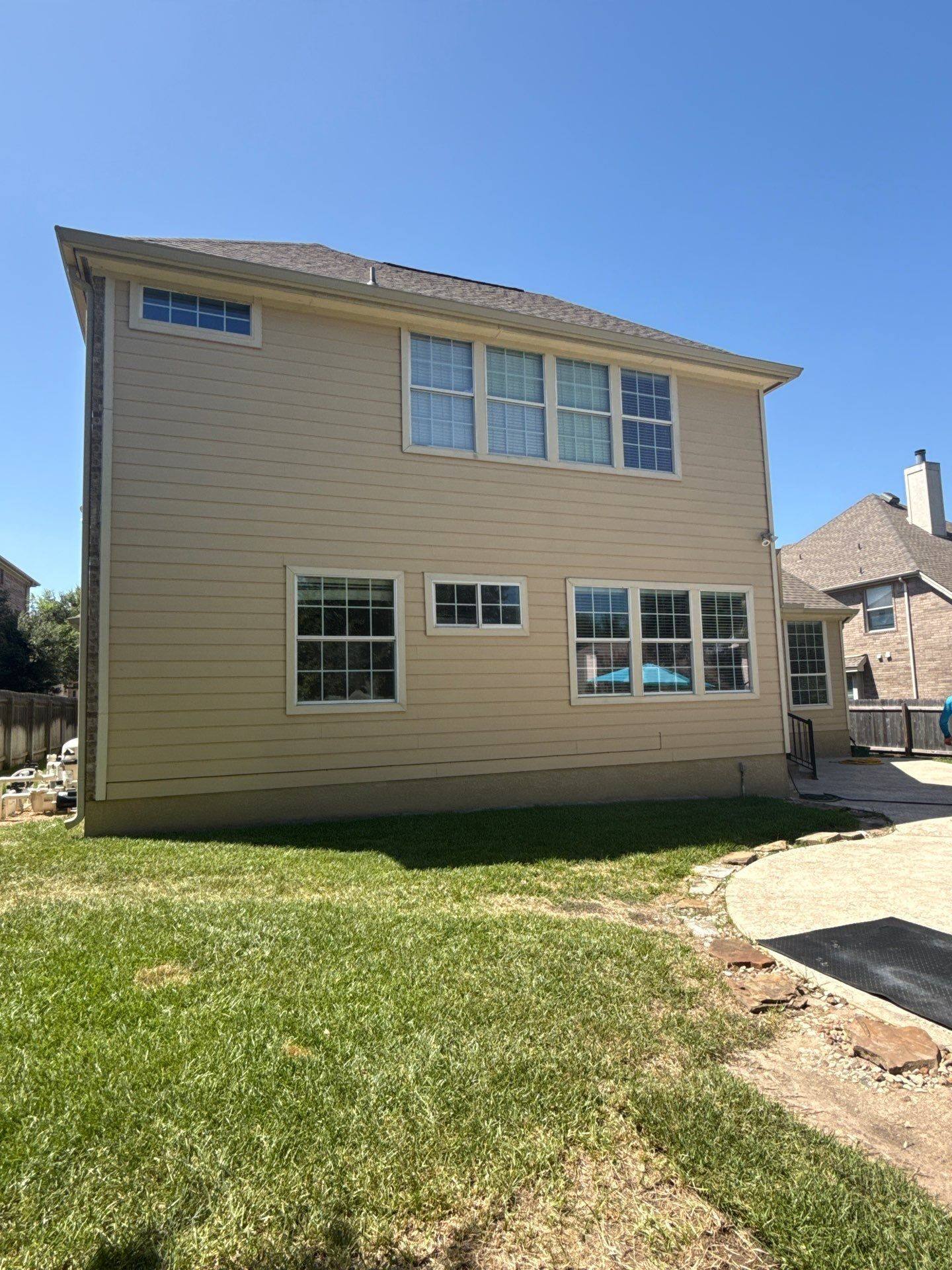 Backyard two-story wall ahead of painting
